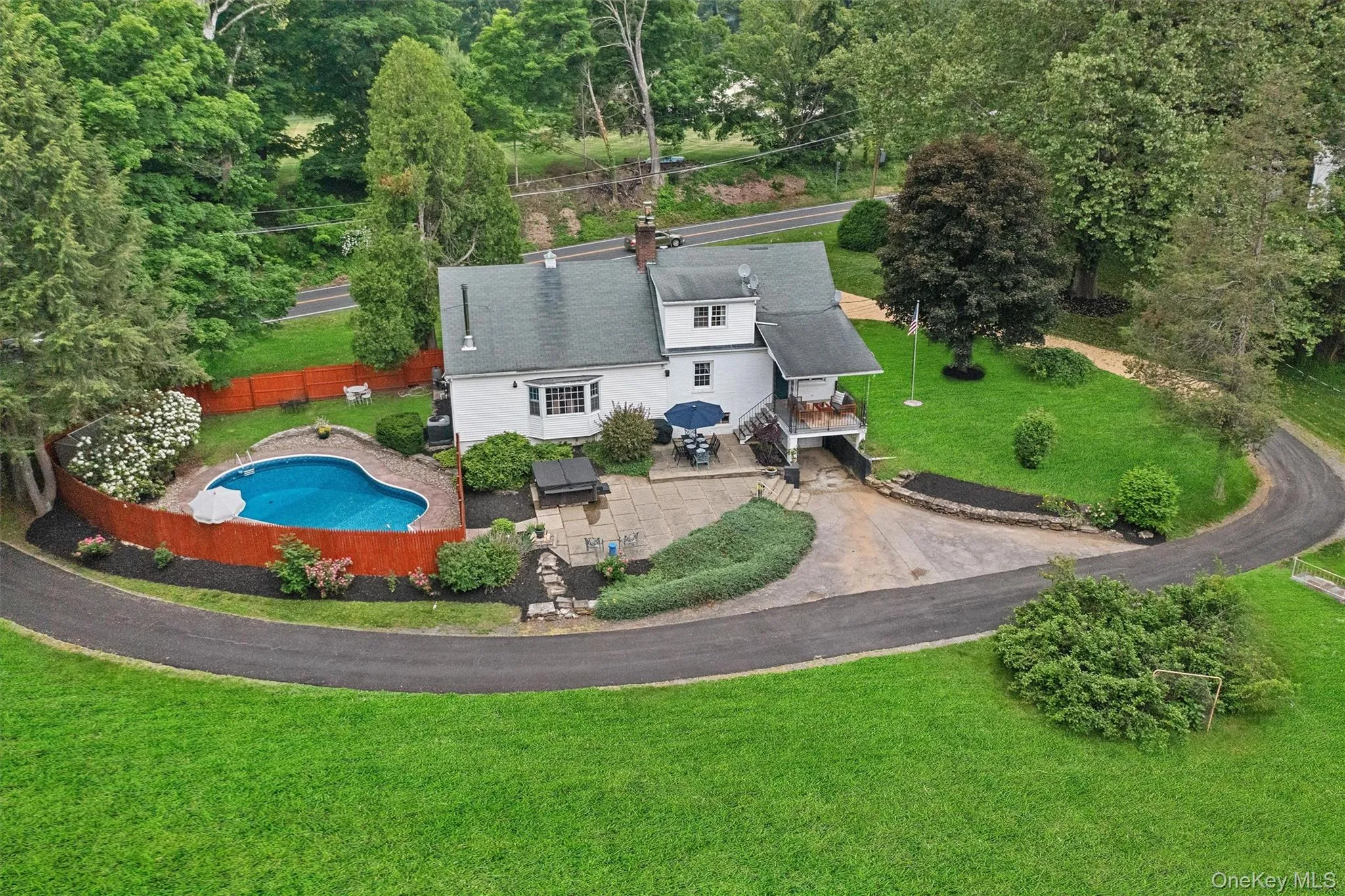 View from above of property with a pool area View from above of property with a pool area