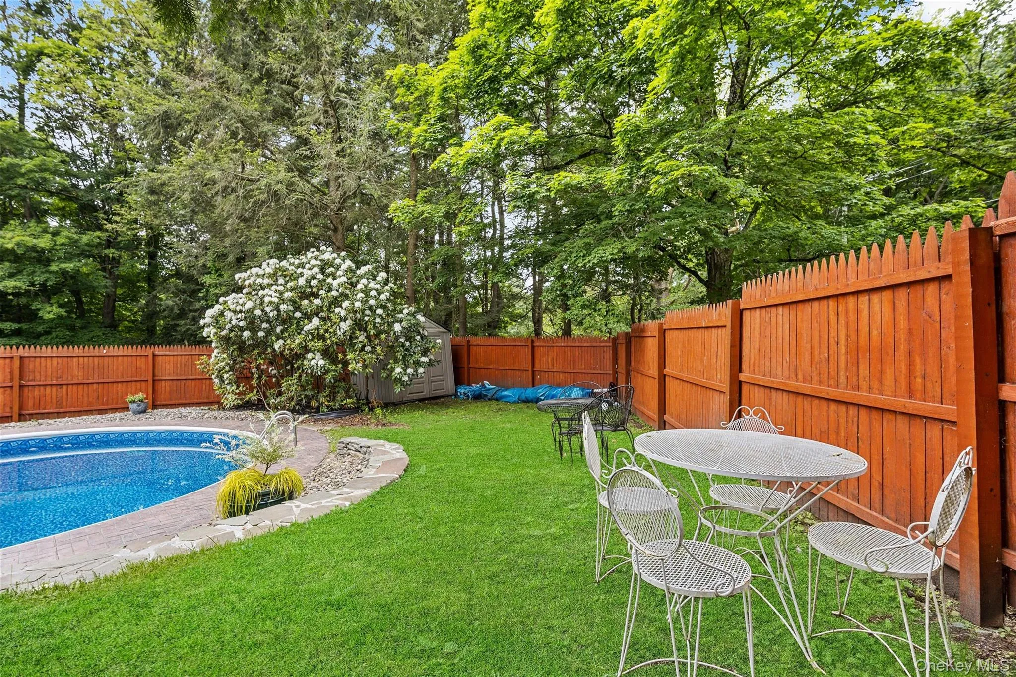 Fenced backyard featuring an outbuilding Fenced backyard featuring an outbuilding