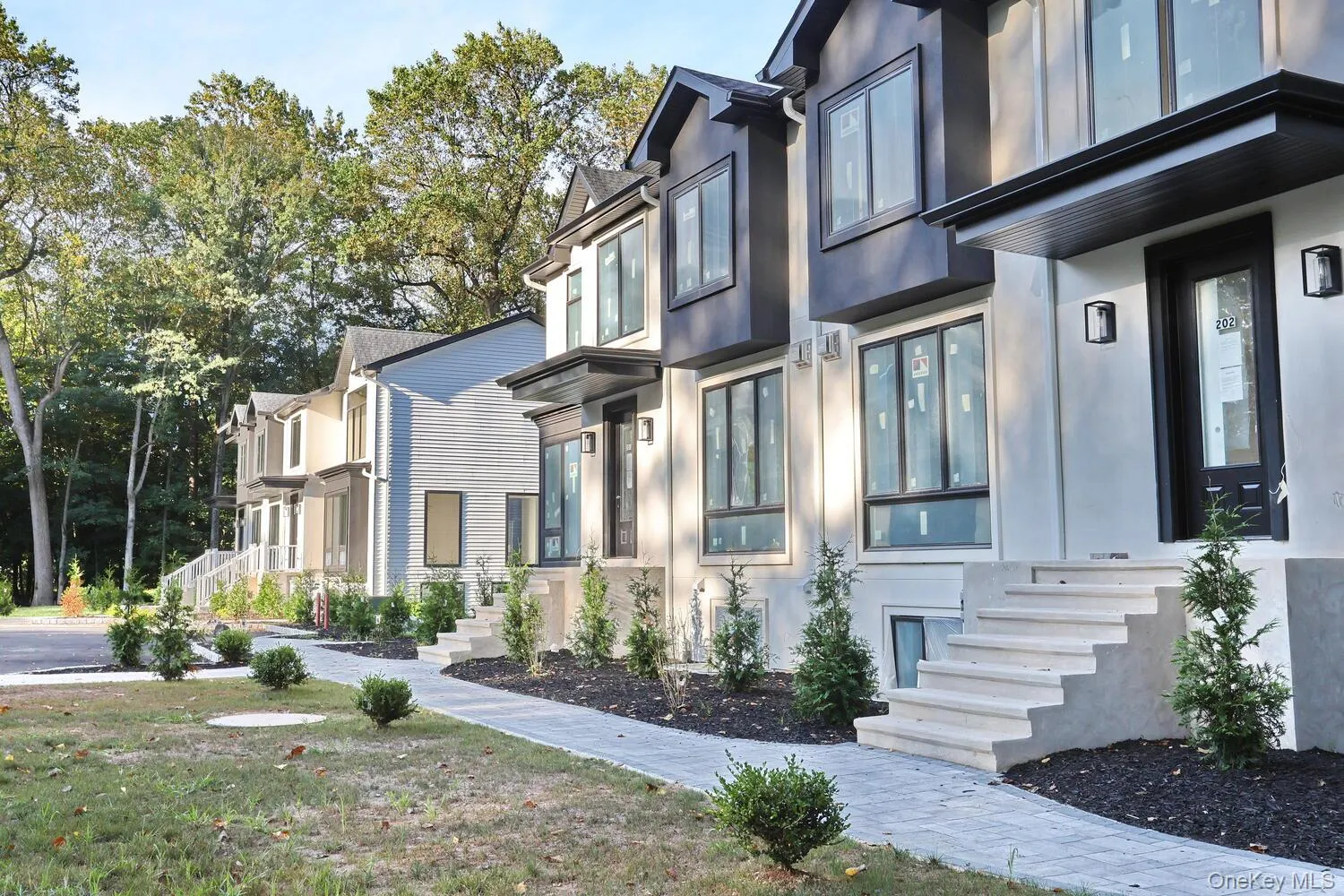 View of property exterior with stucco siding View of property exterior with stucco siding