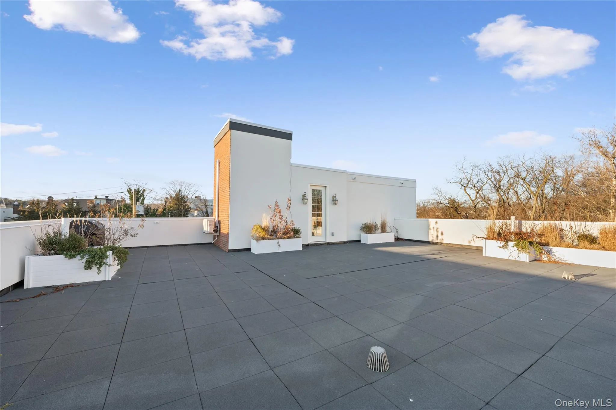 View of outdoor structure featuring a patio and a fenced backyard View of outdoor structure featuring a patio and a fenced backyard