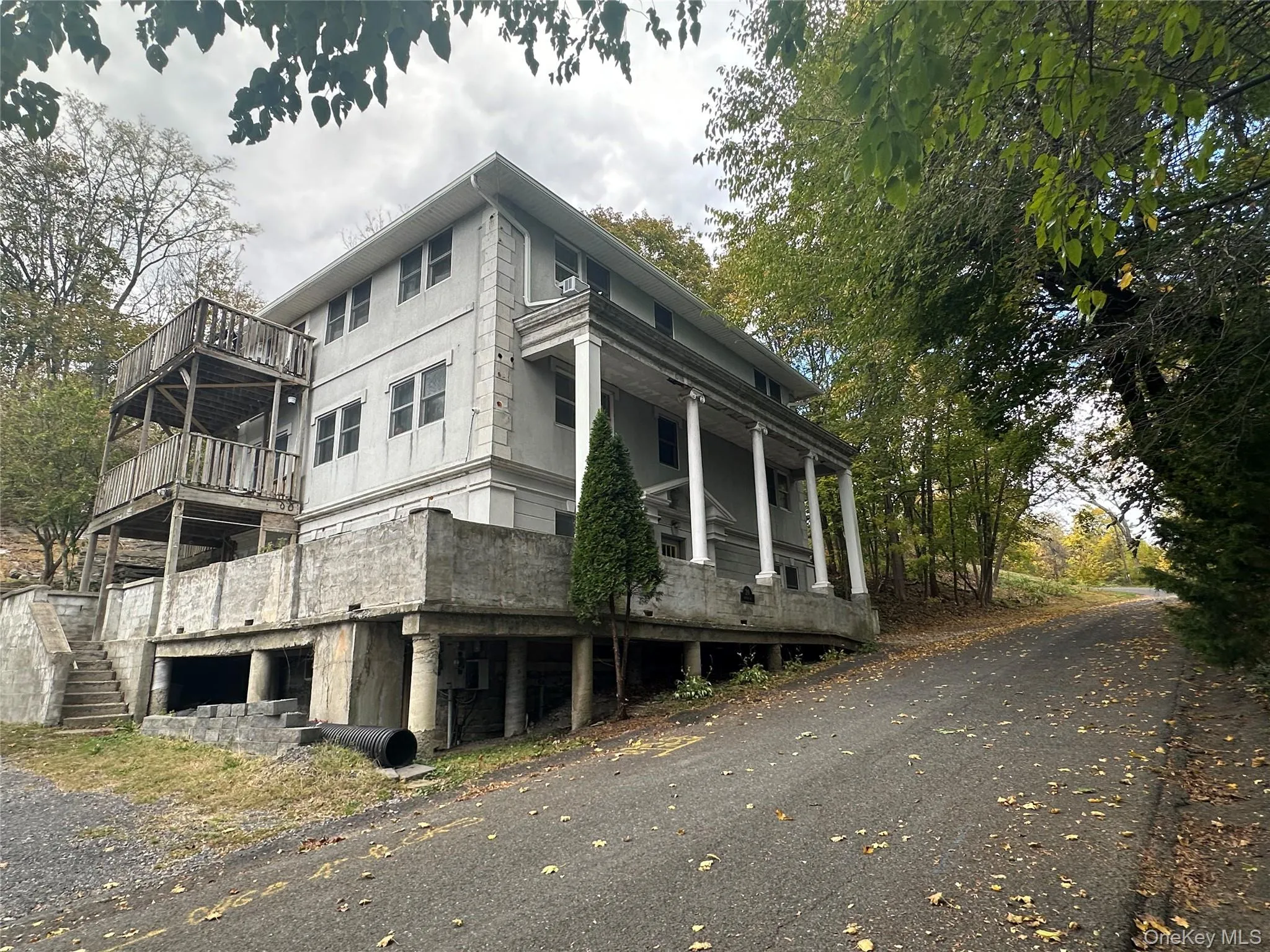 View of side of property featuring a porch View of side of property featuring a porch