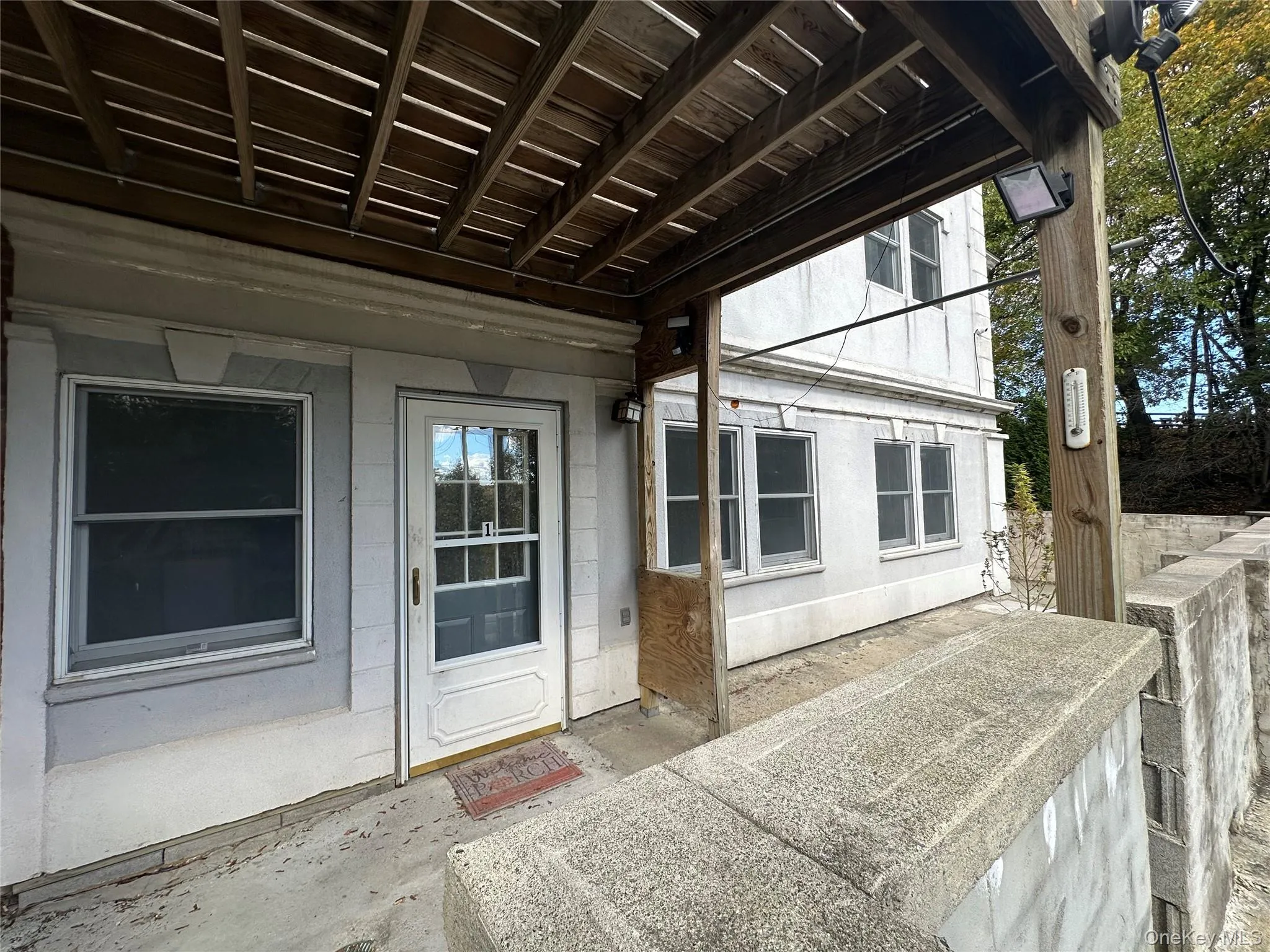 Entrance to property featuring a patio area Entrance to property featuring a patio area