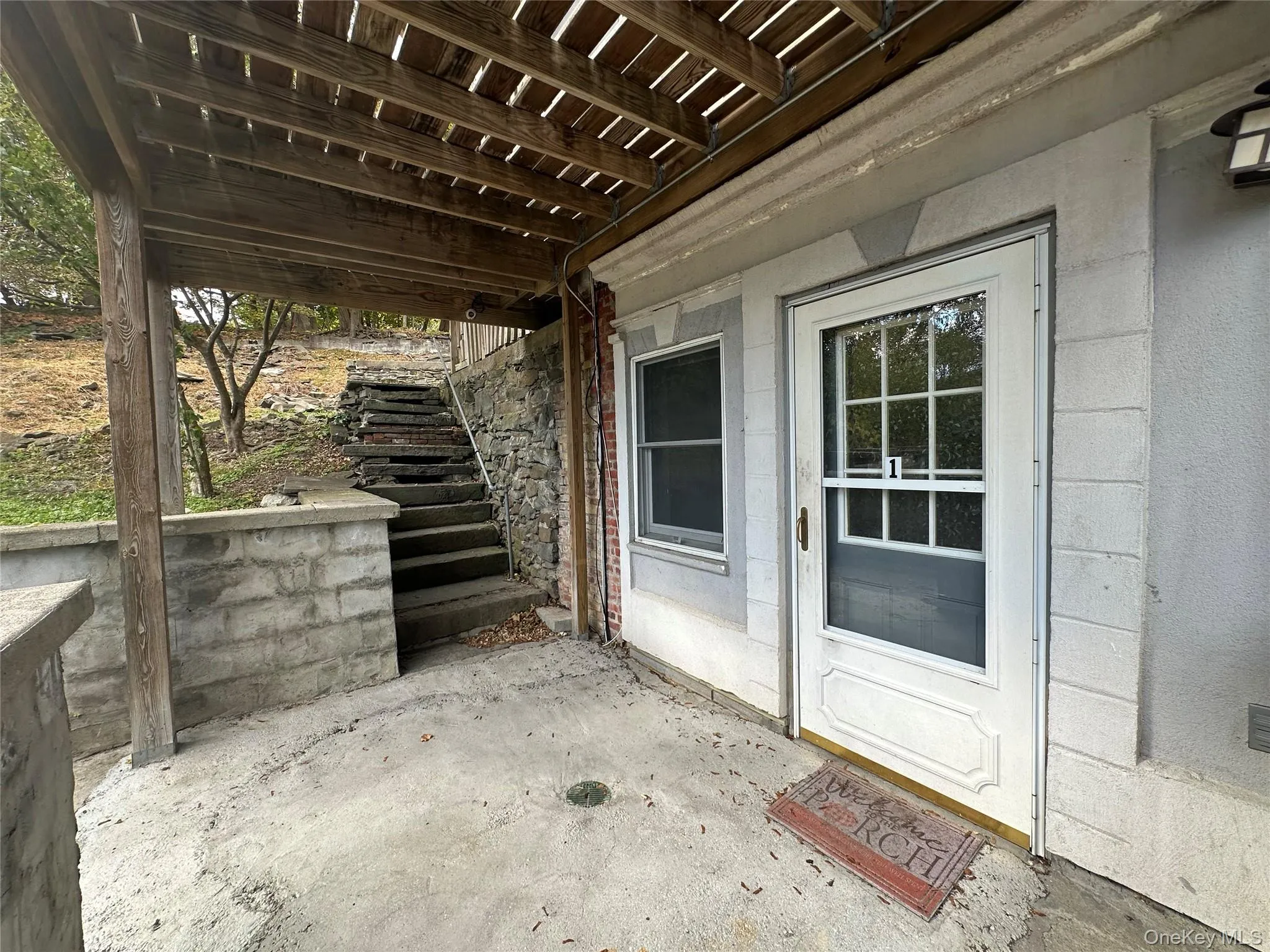 View of patio / terrace featuring stairway View of patio / terrace featuring stairway