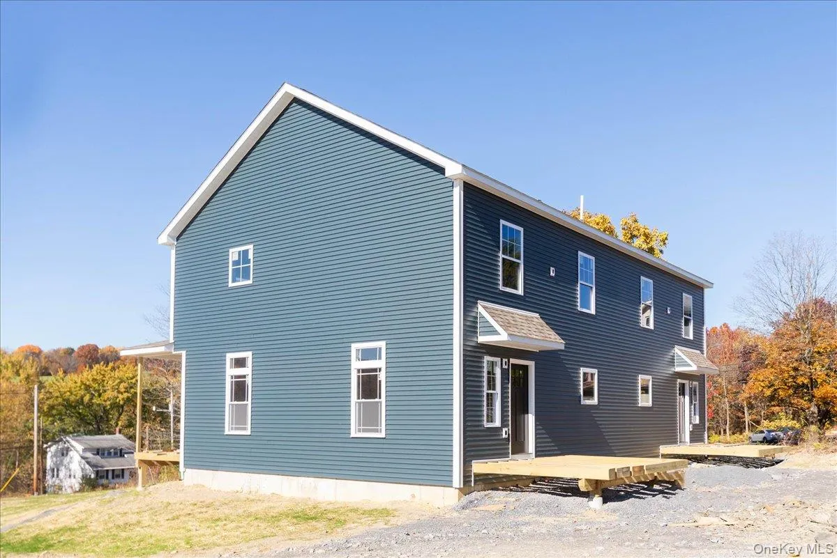 Rear view of property with a deck Rear view of property with a deck