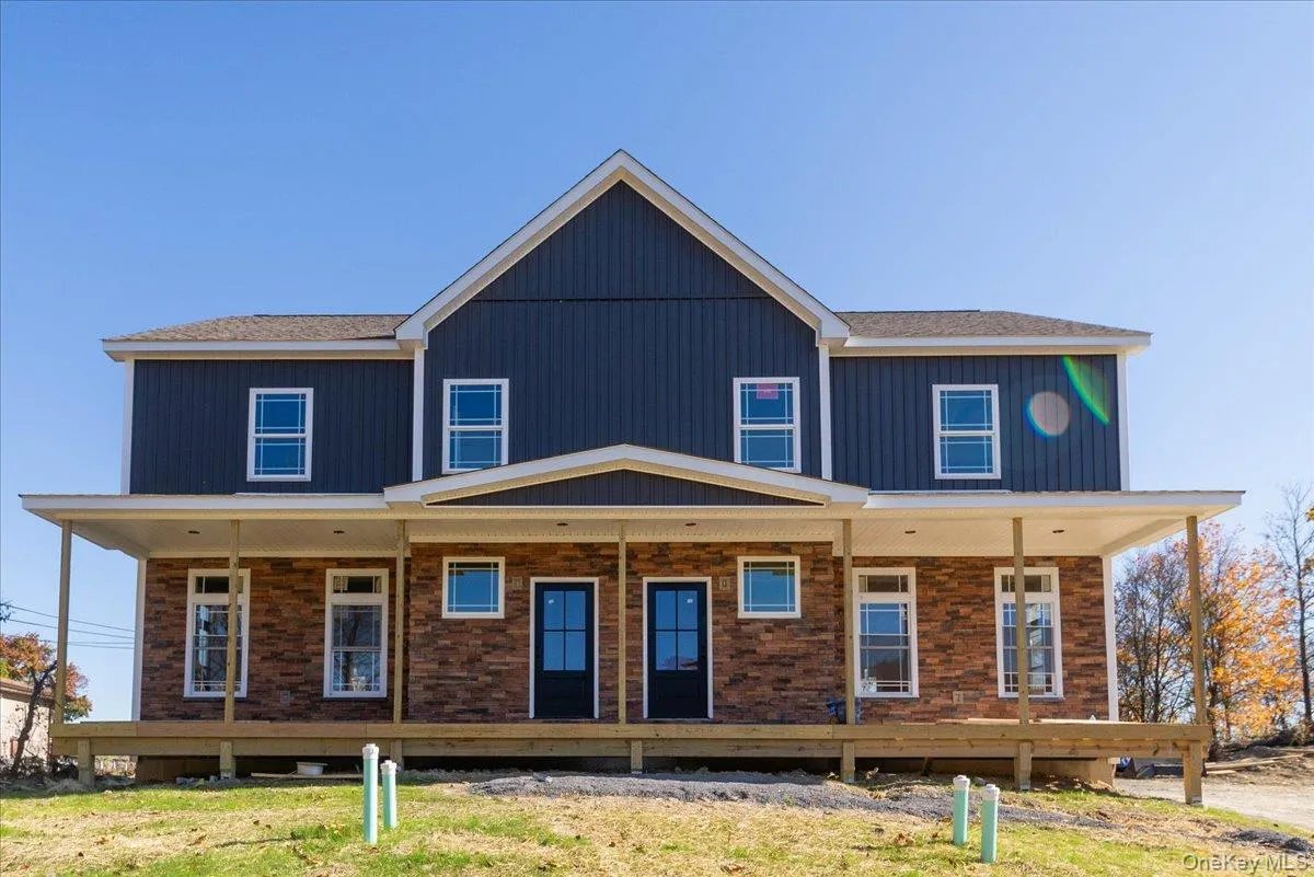 Back of property with covered porch Back of property with covered porch