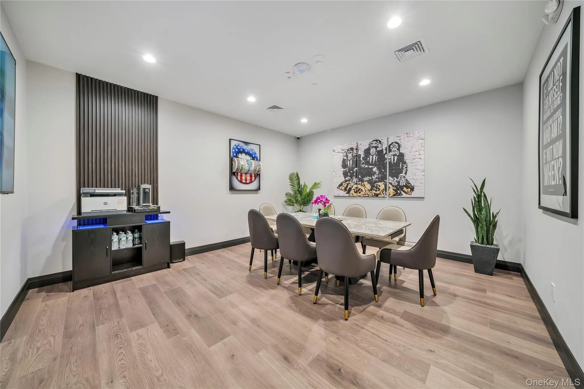 Dining area with baseboards, recessed lighting, and wood finished floors Dining area with baseboards, recessed lighting, and wood finished floors
