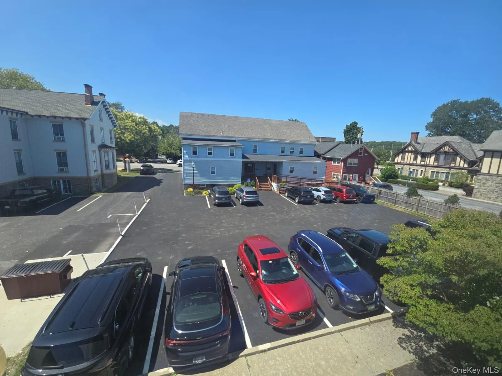 Uncovered parking lot with a residential view Uncovered parking lot with a residential view