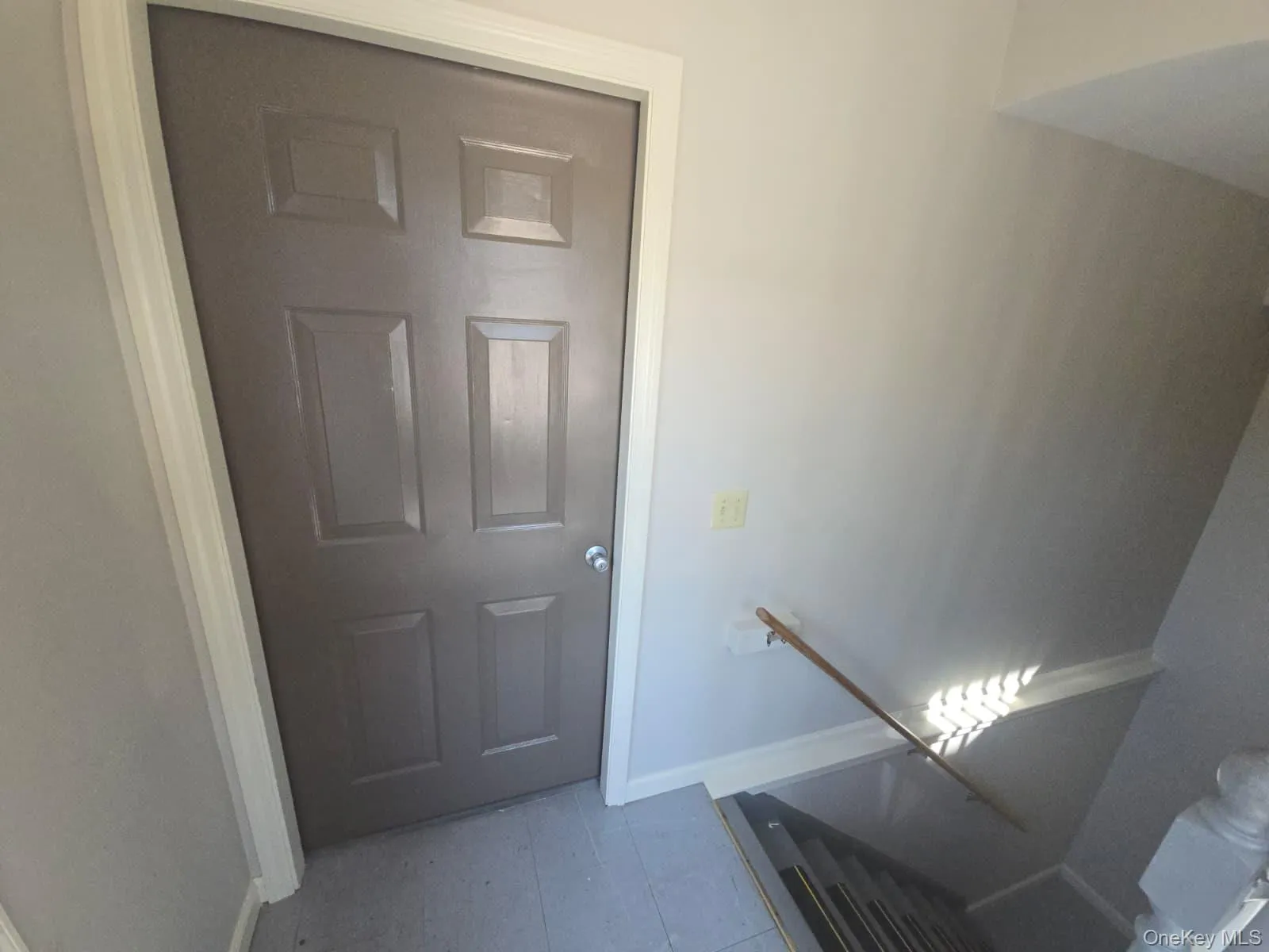 Stairway featuring baseboards Stairway featuring baseboards