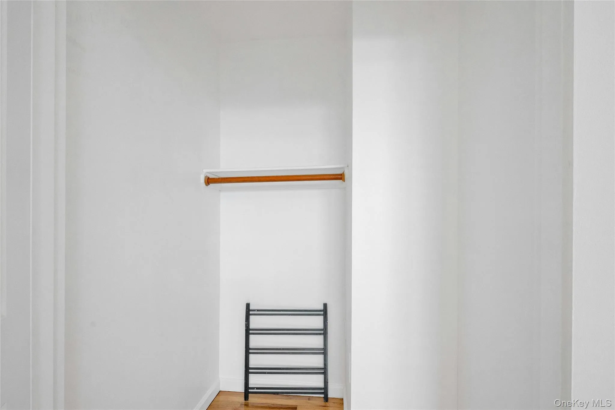 Spacious closet featuring wood finished floors Spacious closet featuring wood finished floors