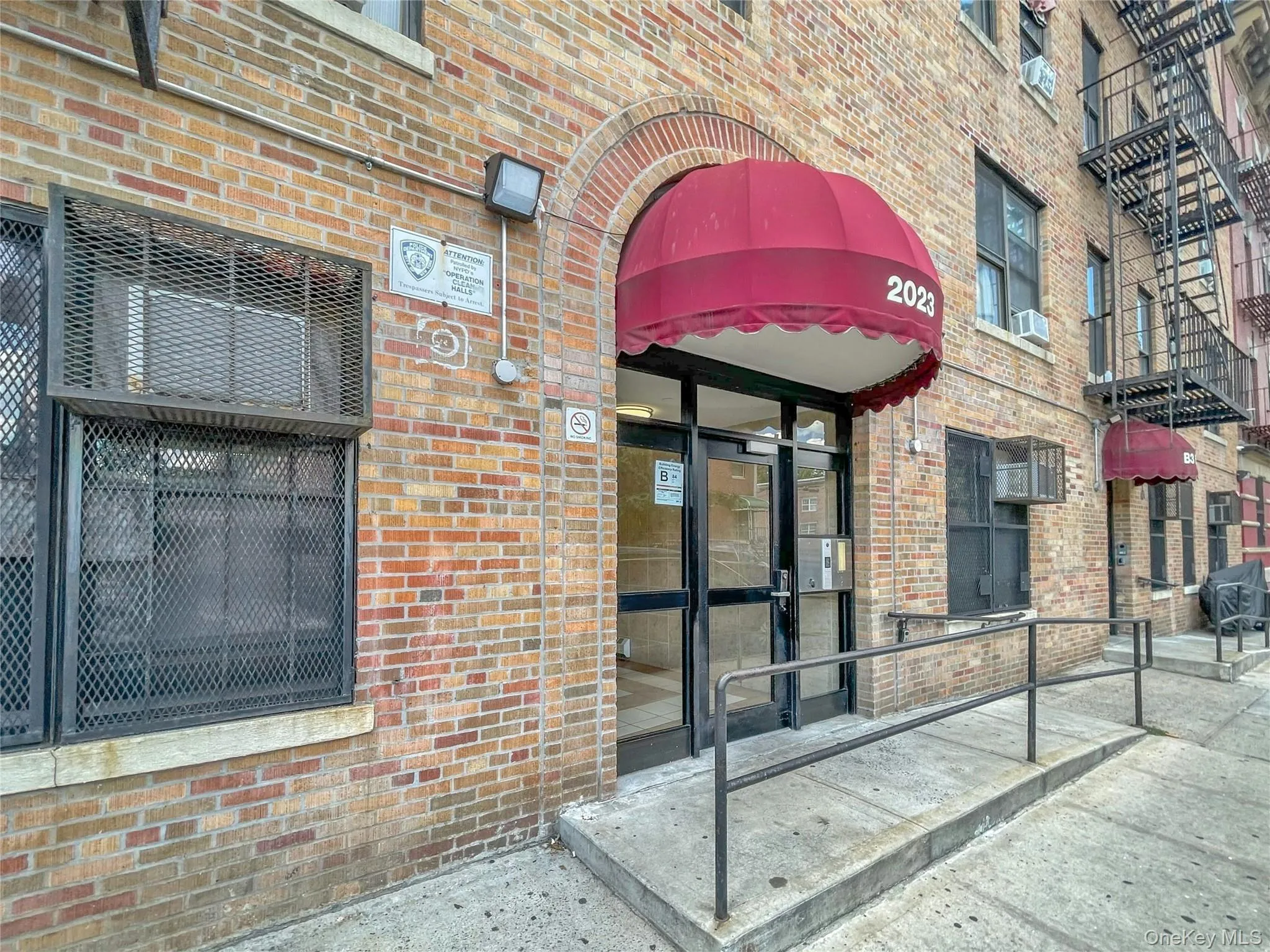 Doorway to property featuring brick siding Doorway to property featuring brick siding