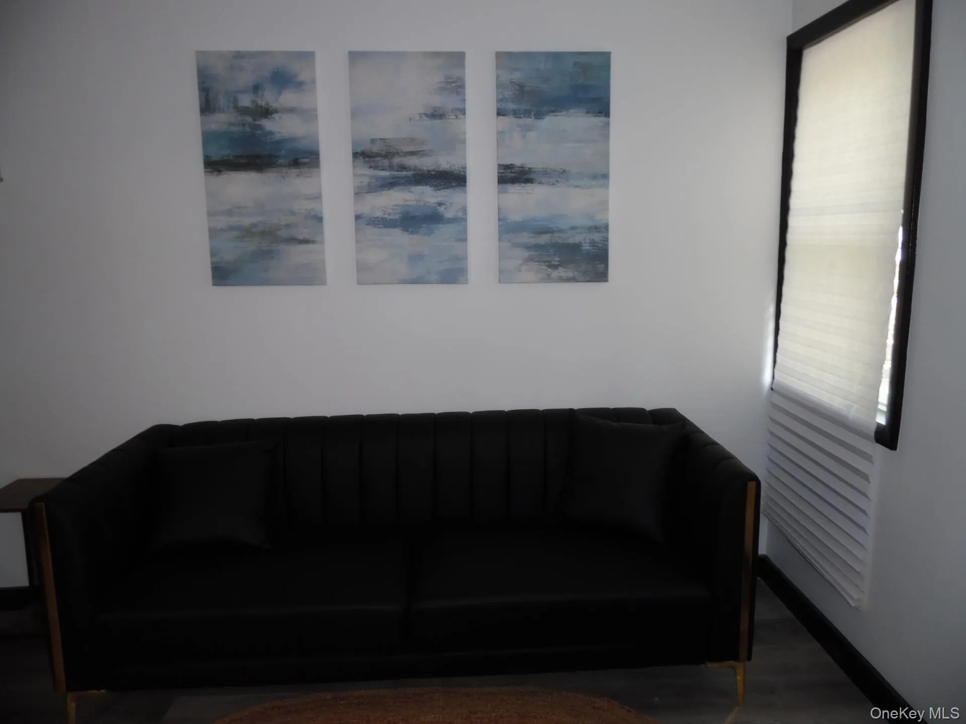 Sitting room featuring wood finished floors Sitting room featuring wood finished floors