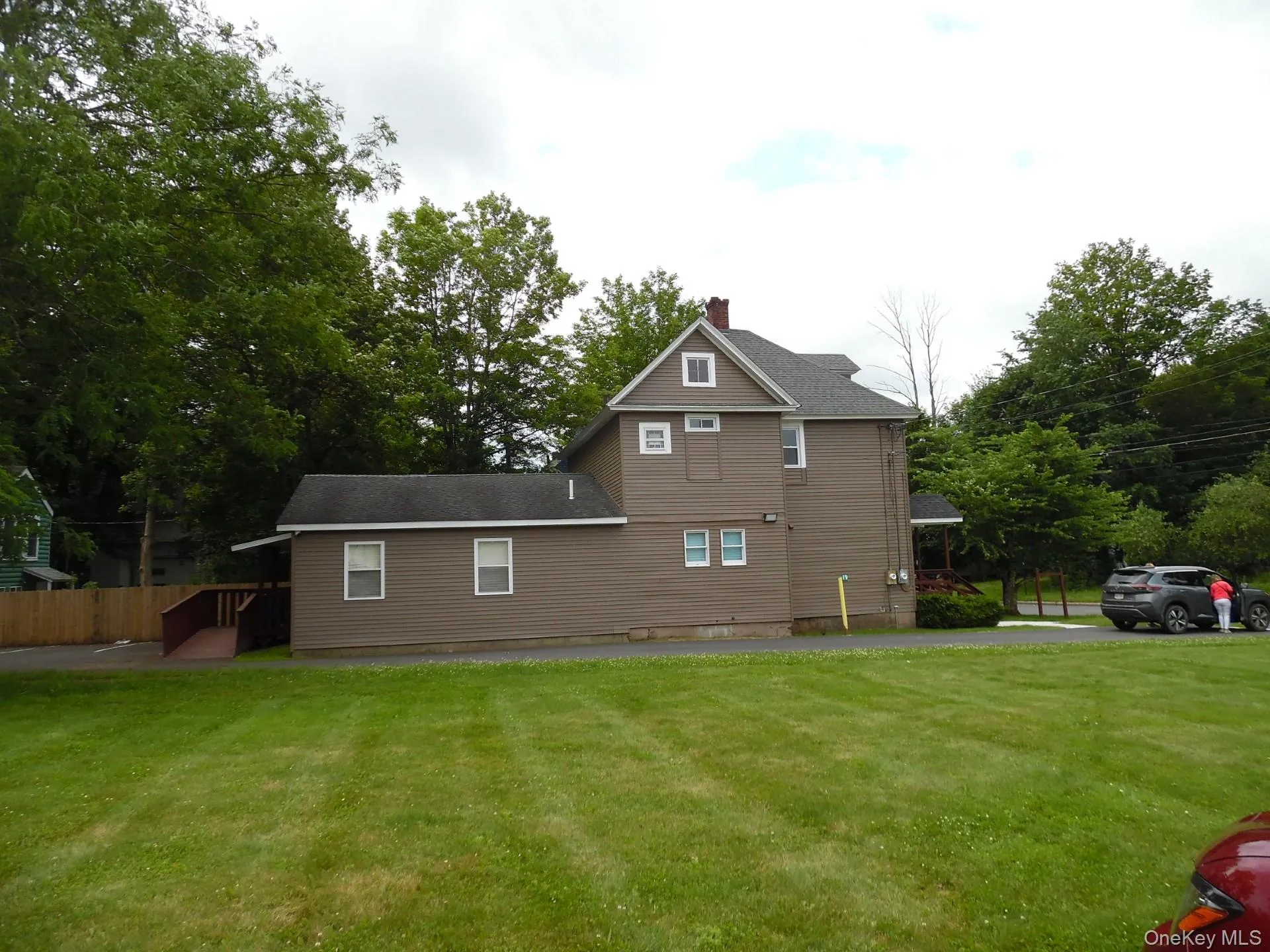 Side view. featuring a lawn. Side view. featuring a lawn.