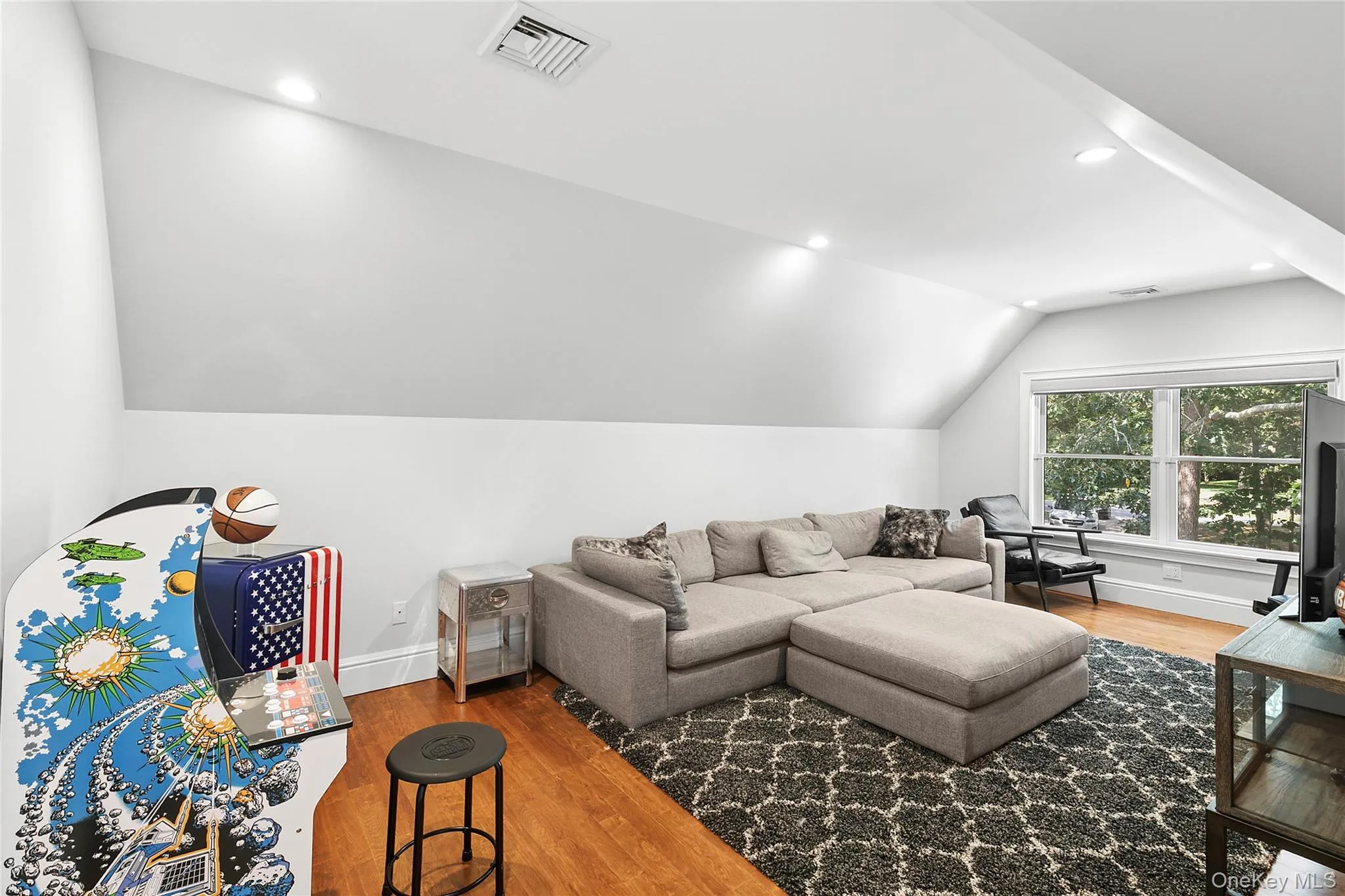 Bedroom used as bonus featuring light wood finished floors, lofted ceiling, and recessed lighting Bedroom used as bonus featuring light wood finished floors, lofted ceiling, and recessed lighting