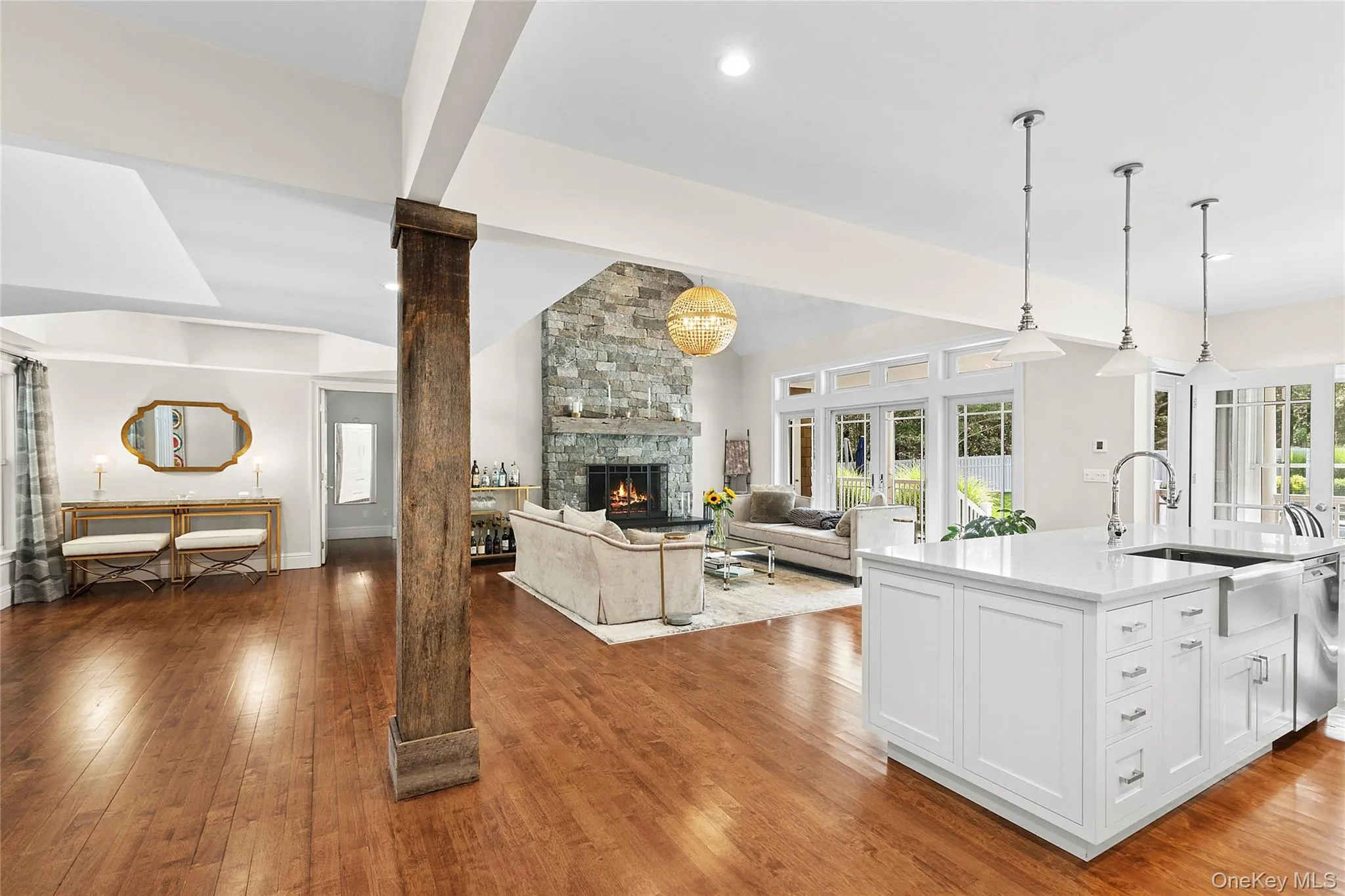 Kitchen with an island with sink, open floor plan, light wood finished floors Kitchen with an island with sink, open floor plan, light wood finished floors