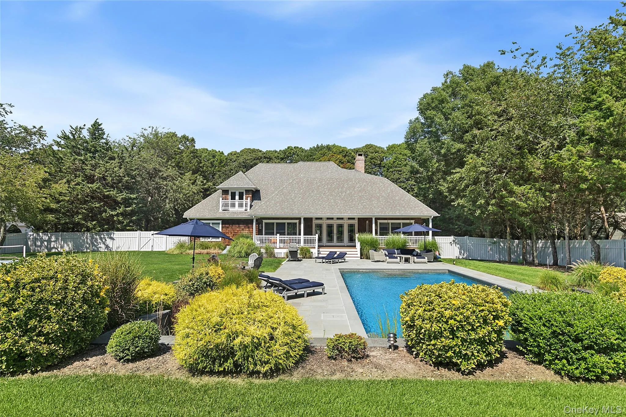 View of swimming pool with a sunroom, a patio, and an outdoor hangout area View of swimming pool with a sunroom, a patio, and an outdoor hangout area