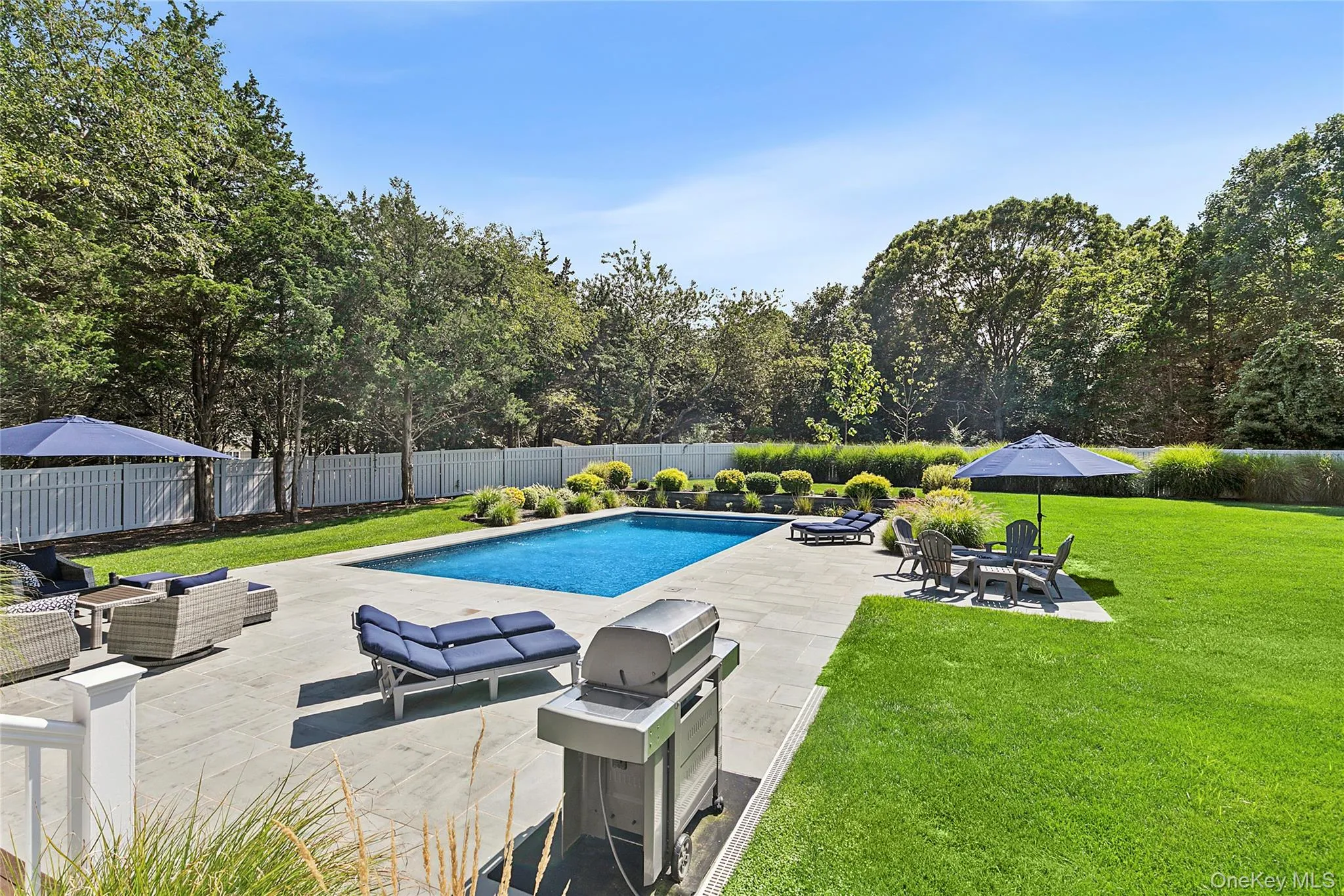 View of swimming pool featuring an outdoor hangout area, a patio, a fenced backyard, and grilling area View of swimming pool featuring an outdoor hangout area, a patio, a fenced backyard, and grilling area
