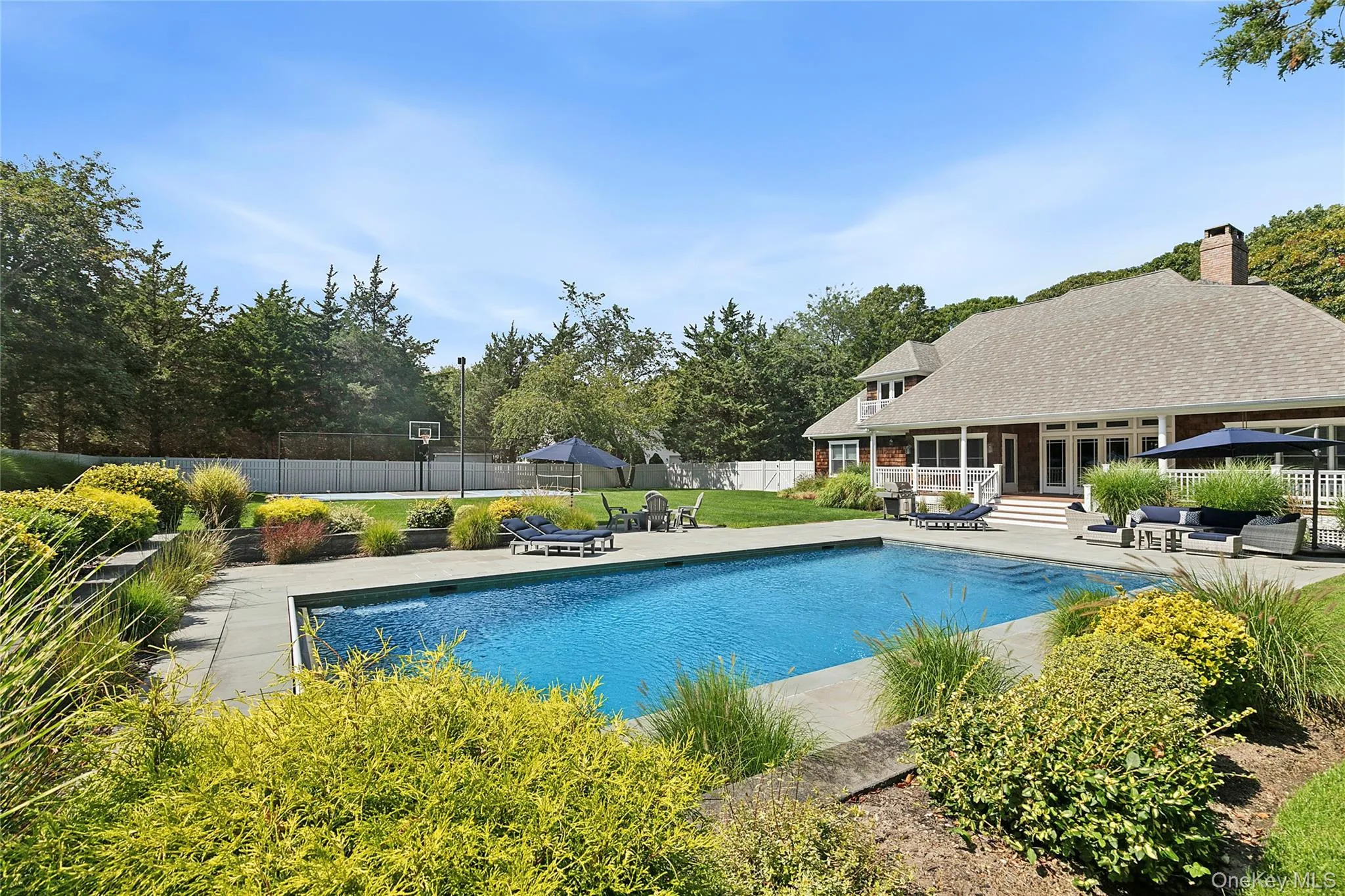 View of pool with a patio area and an outdoor living space View of pool with a patio area and an outdoor living space