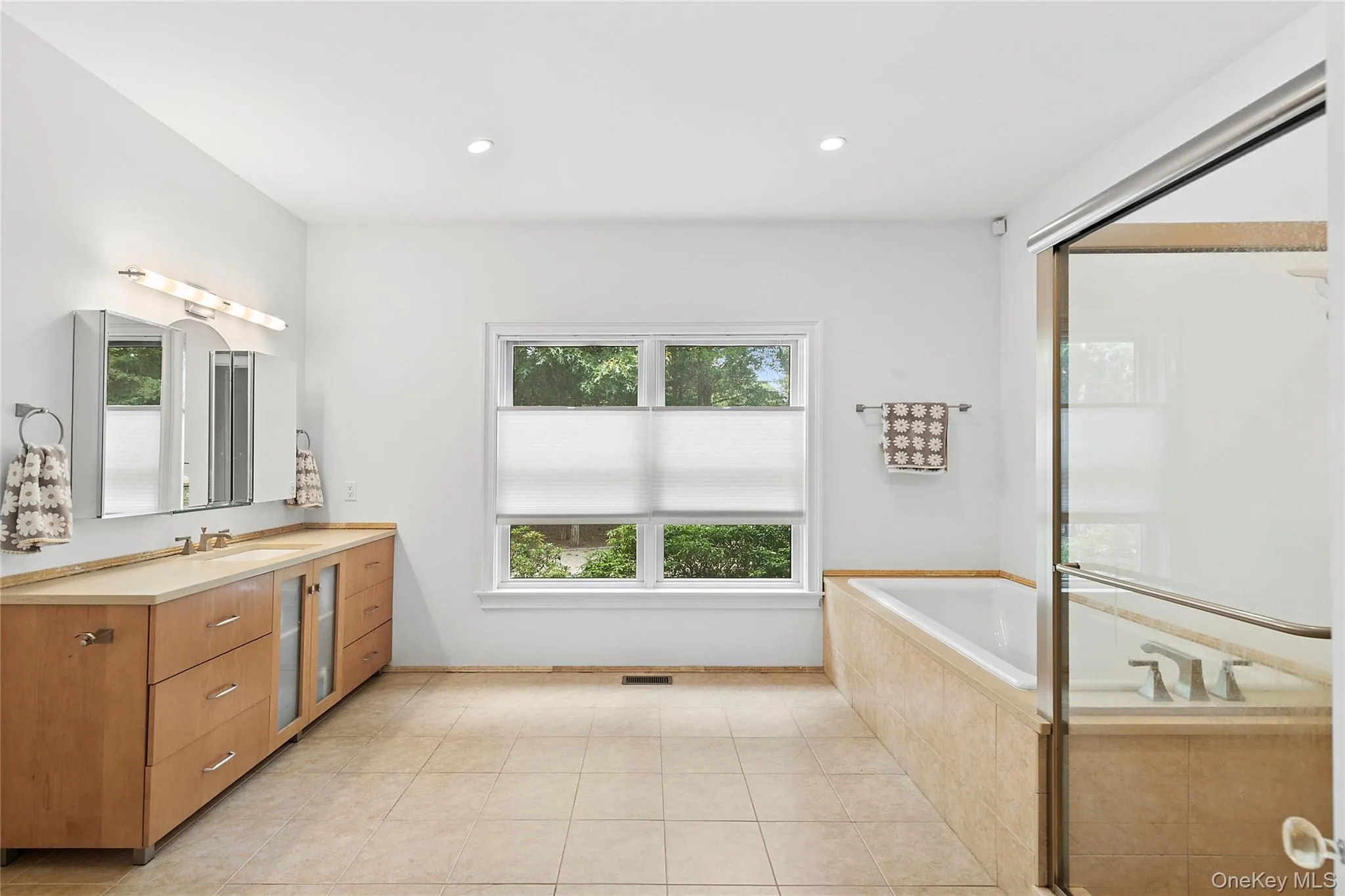 Primary Bathroom with vanity, a bath, light tile patterned floors, recessed lighting, and a shower stall Primary Bathroom with vanity, a bath, light tile patterned floors, recessed lighting, and a shower stall
