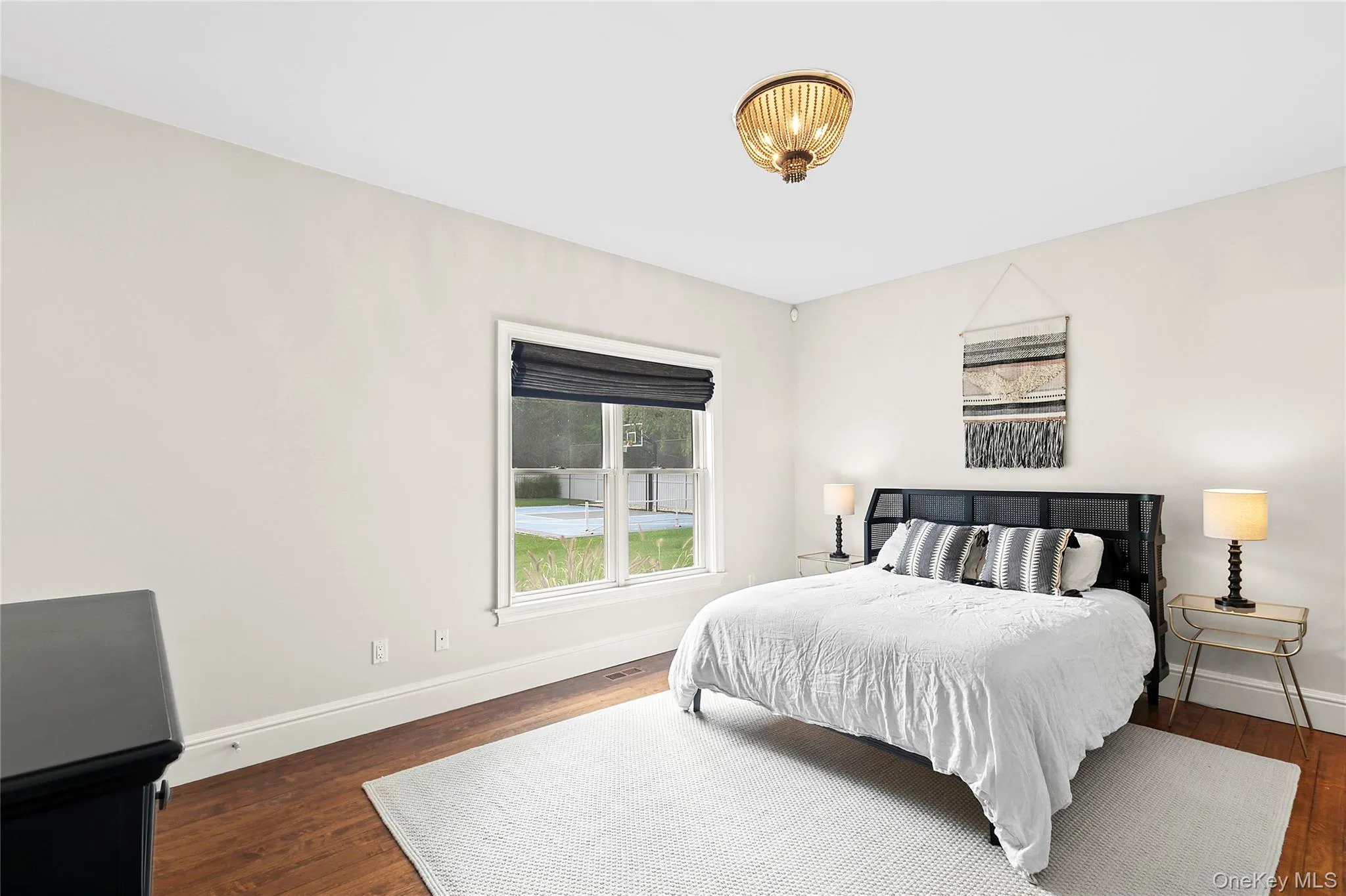 Bedroom en suite with wood flooring and Bedroom en suite with wood flooring and