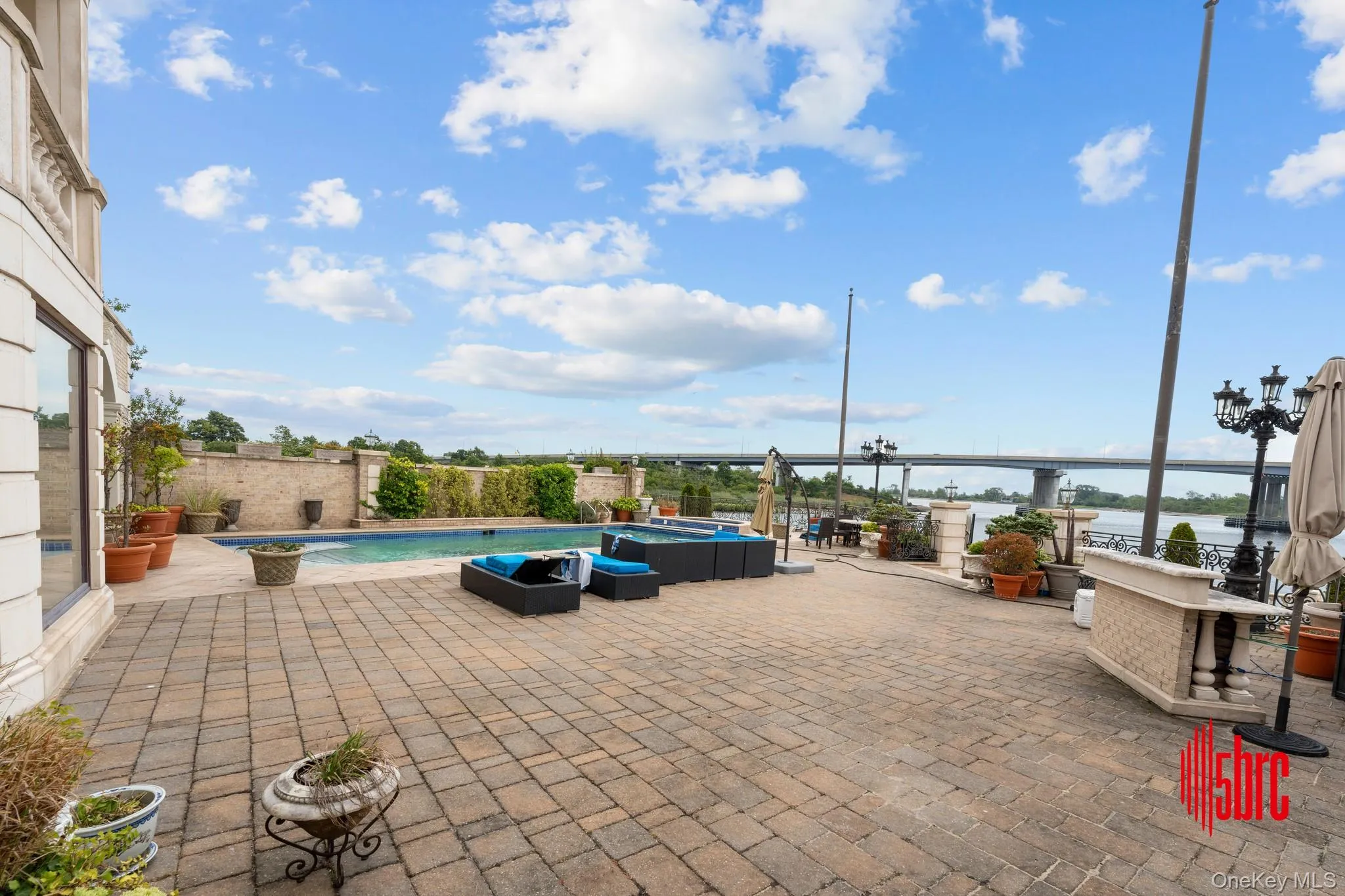 View of patio / terrace with an outdoor hangout area and a water view View of patio / terrace with an outdoor hangout area and a water view