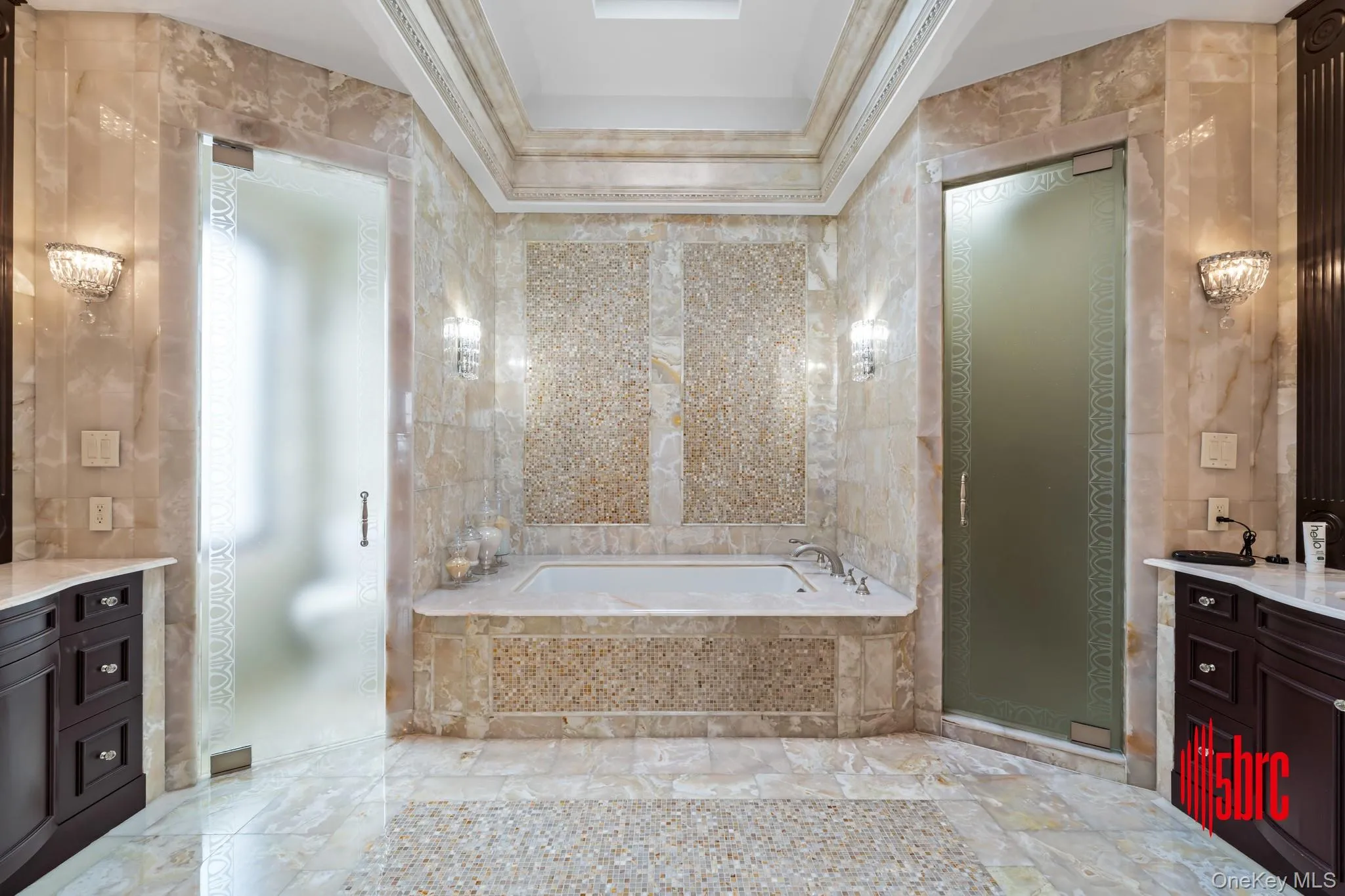 Full bath with tile walls, a bath, and vanity Full bath with tile walls, a bath, and vanity
