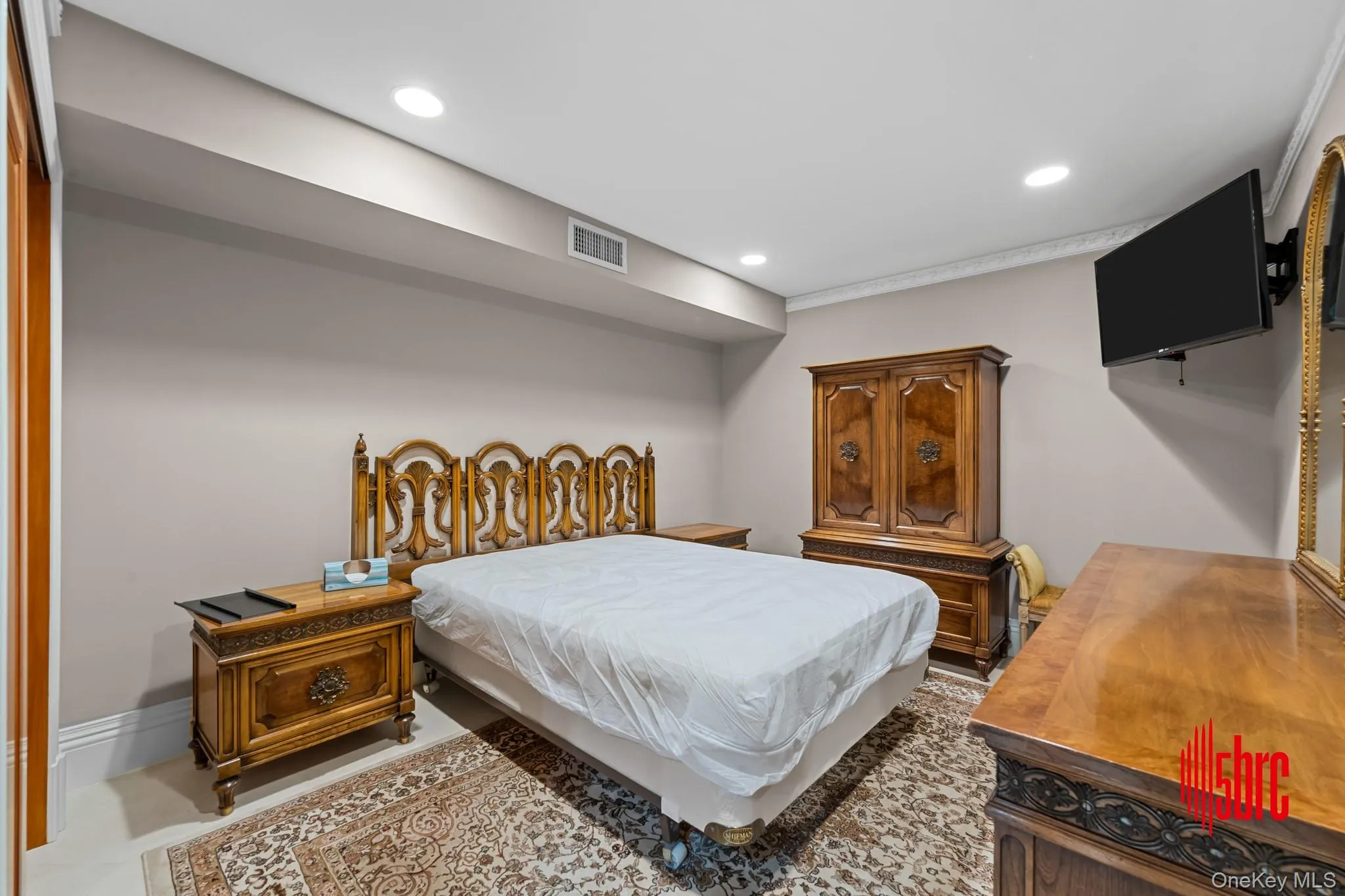 Bedroom featuring recessed lighting and baseboards Bedroom featuring recessed lighting and baseboards