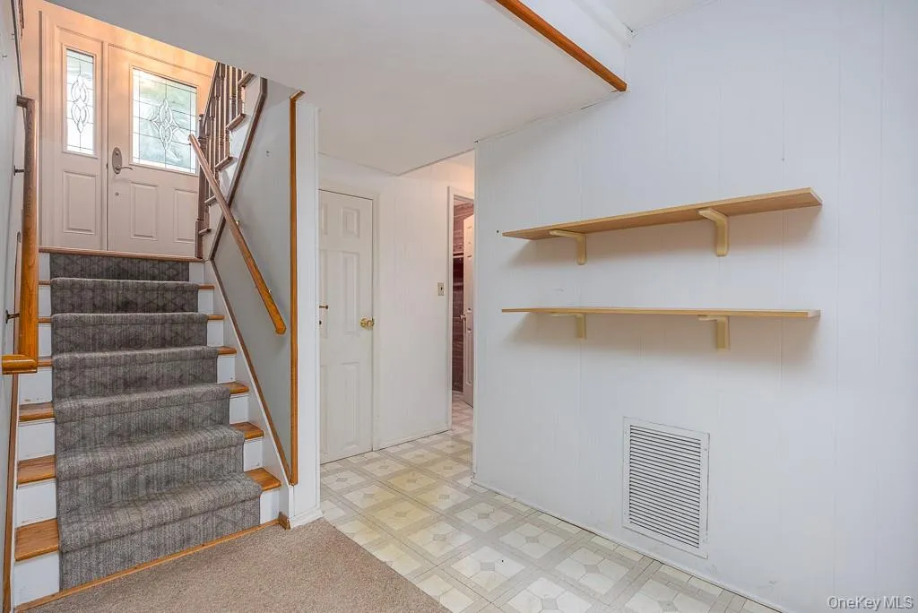 Staircase featuring tile patterned floors Staircase featuring tile patterned floors