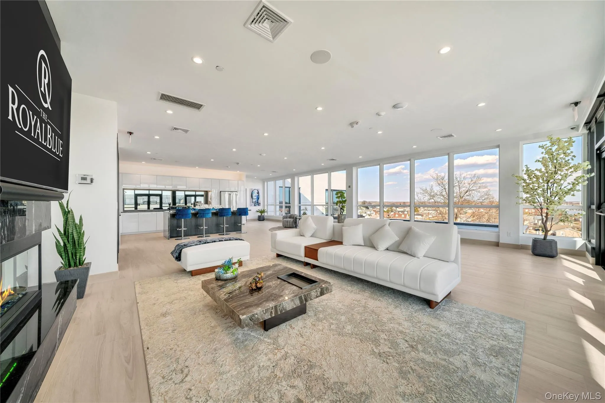 Living room with visible vents, recessed lighting, and light wood finished floors Living room with visible vents, recessed lighting, and light wood finished floors