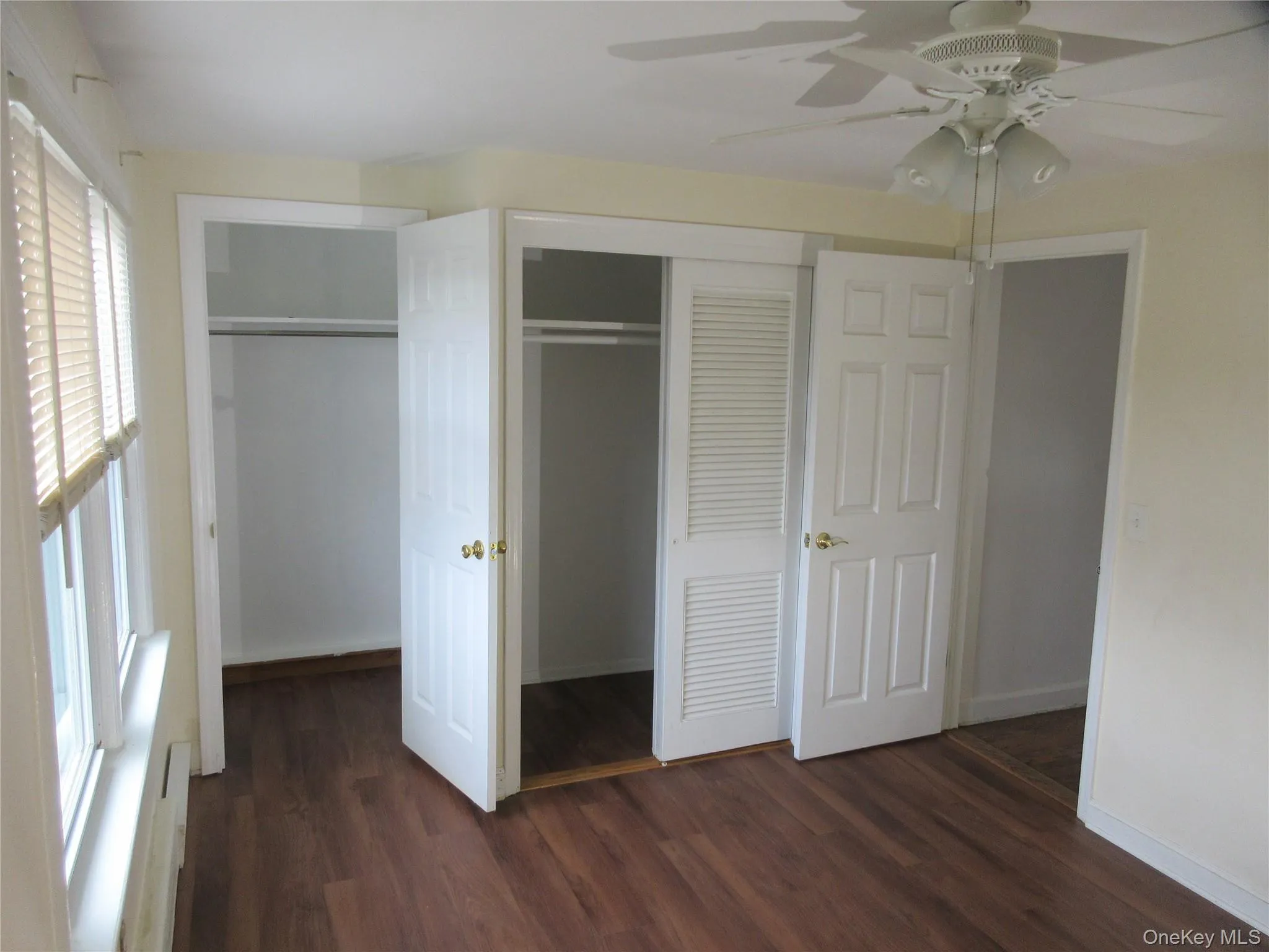Closet featuring baseboard heating Closet featuring baseboard heating