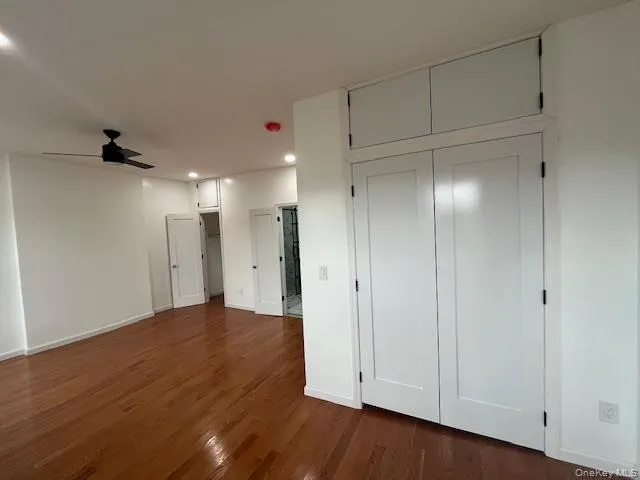 Unfurnished bedroom with dark wood-style flooring, recessed lighting, and ceiling fan Unfurnished bedroom with dark wood-style flooring, recessed lighting, and ceiling fan