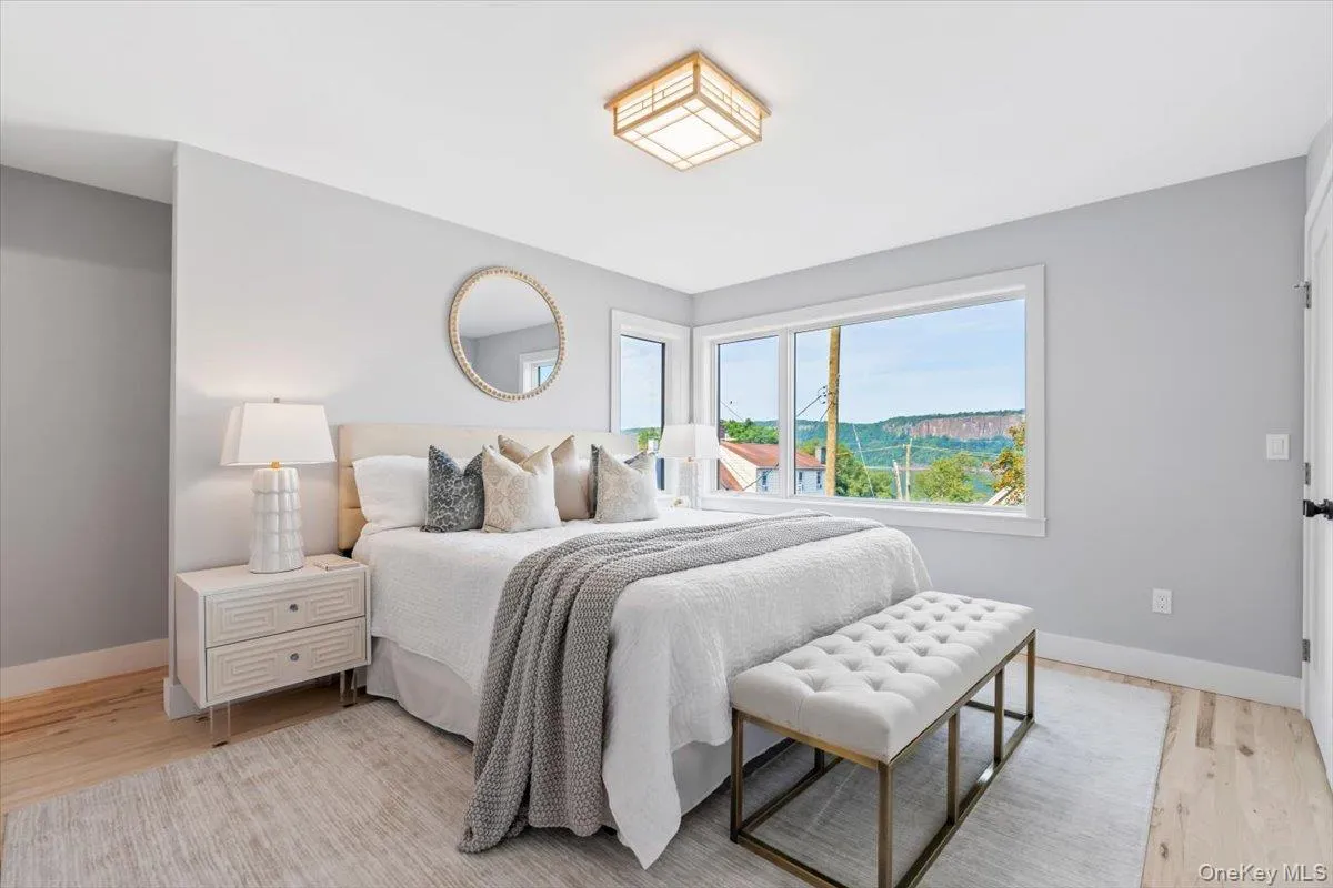 Spacious primary suite with abundant natural light and serene views Spacious primary suite with abundant natural light and serene views