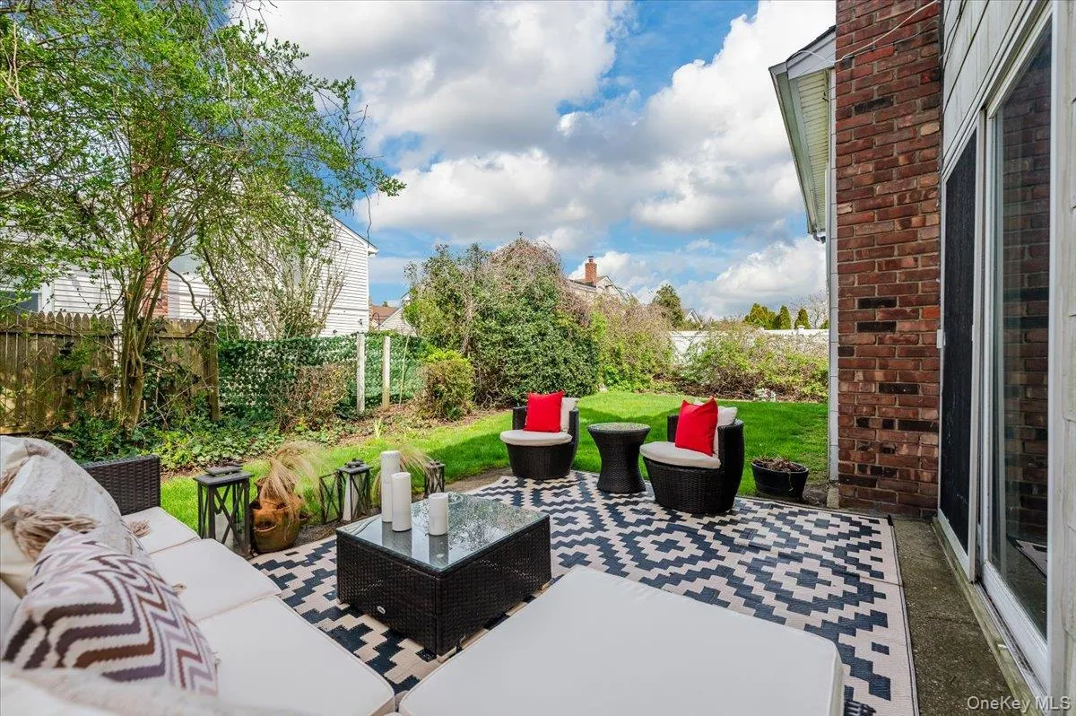 Fenced backyard with a patio area and an outdoor living space Fenced backyard with a patio area and an outdoor living space