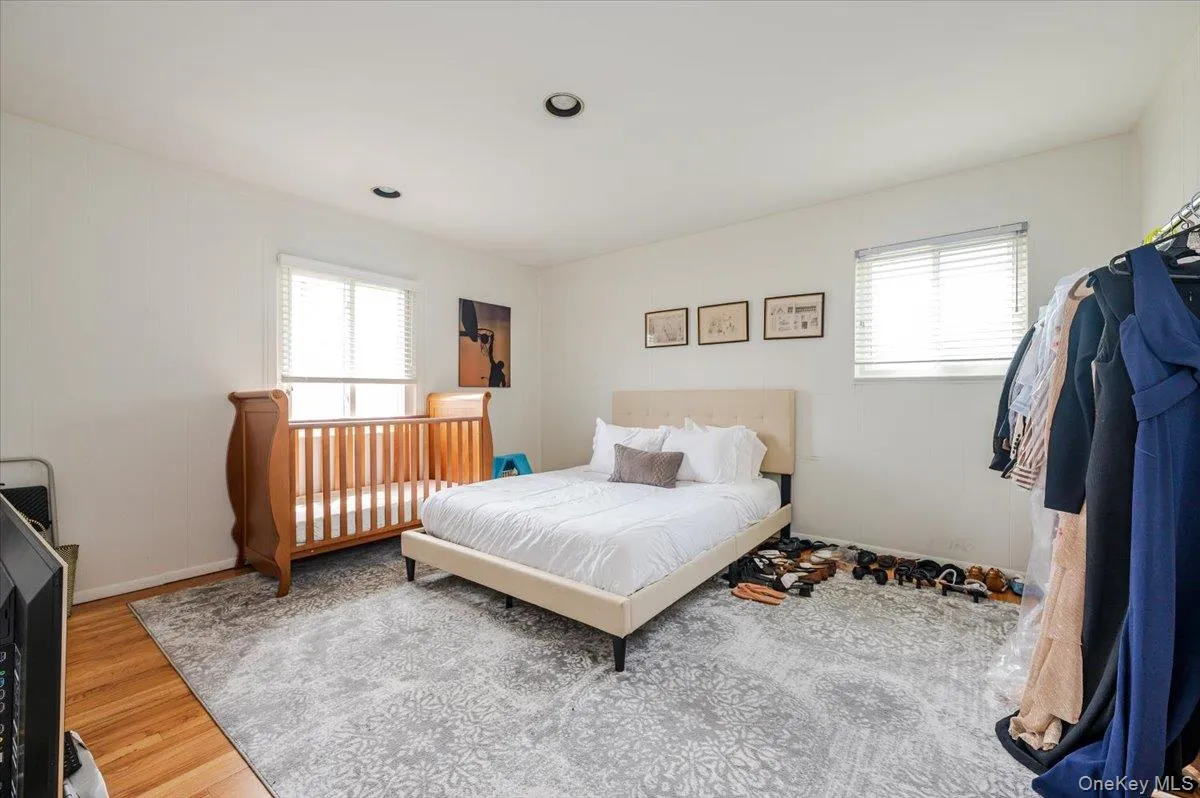Bedroom featuring wood finished floors and recessed lighting Bedroom featuring wood finished floors and recessed lighting