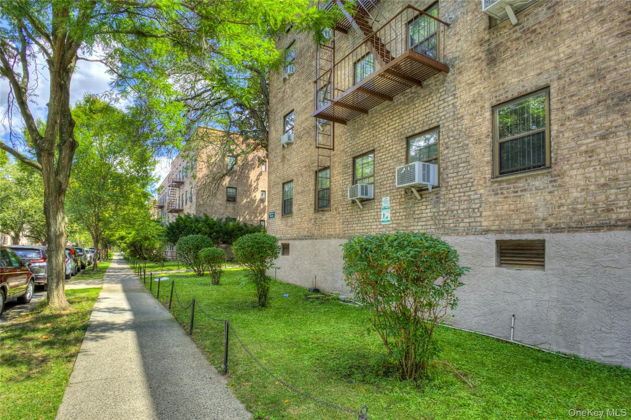 View of home's exterior featuring a lawn and brick siding View of home's exterior featuring a lawn and brick siding