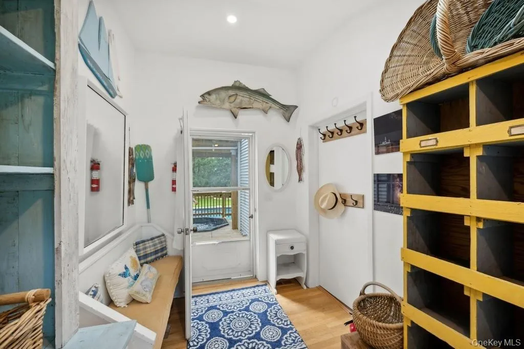 Mudroom featuring light wood finished floors Mudroom featuring light wood finished floors
