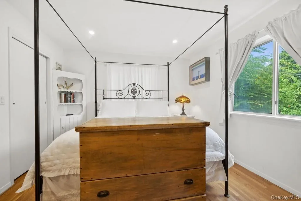 Bedroom with wood finished floors and recessed lighting Bedroom with wood finished floors and recessed lighting