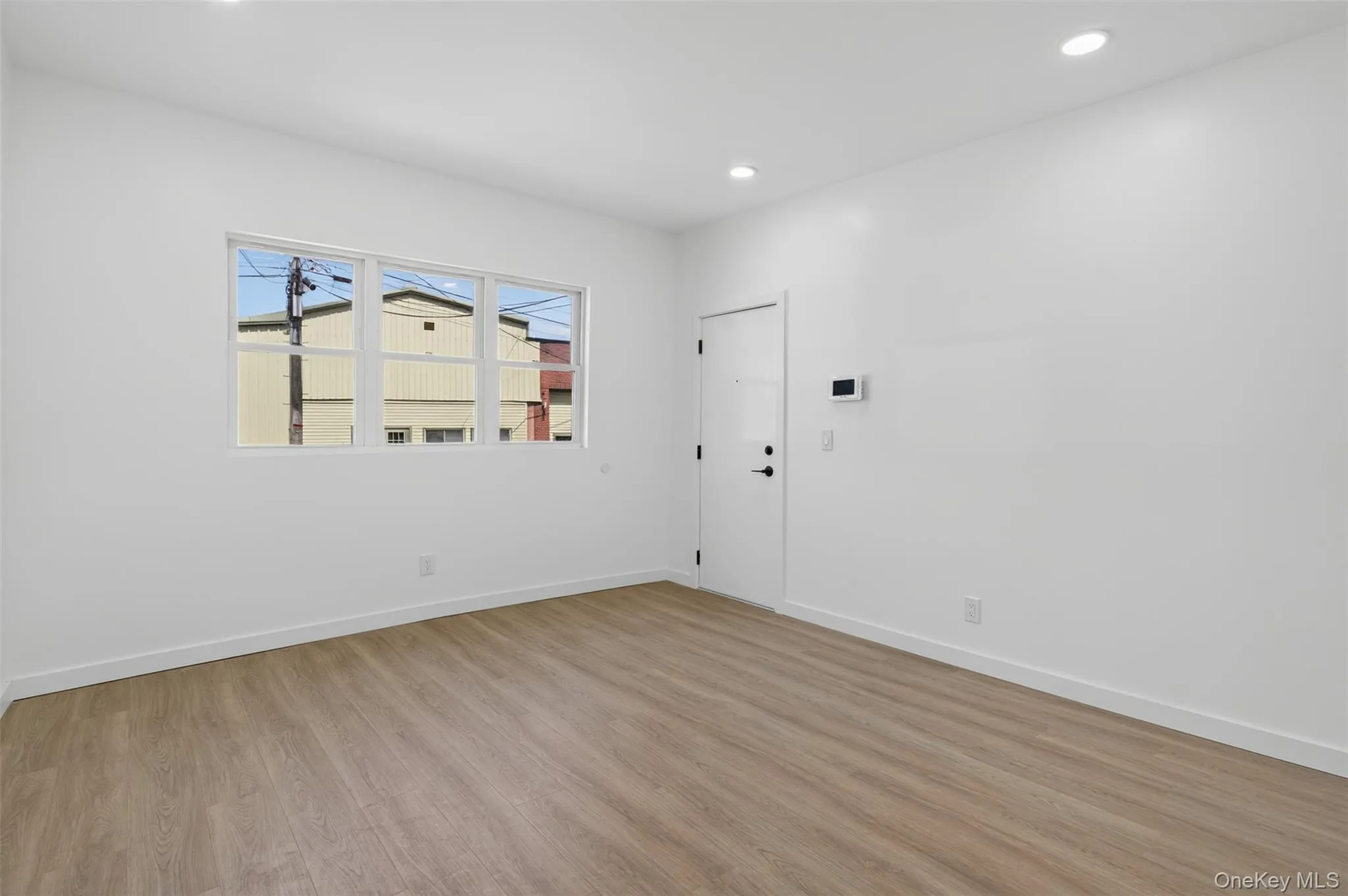 Spare room featuring light wood-style floors and recessed lighting Spare room featuring light wood-style floors and recessed lighting