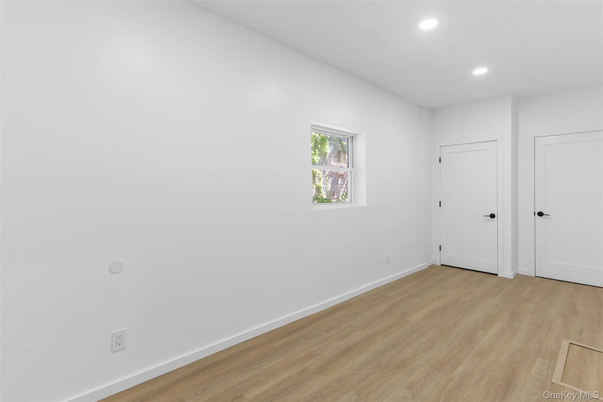 Unfurnished room featuring light wood-type flooring and recessed lighting Unfurnished room featuring light wood-type flooring and recessed lighting