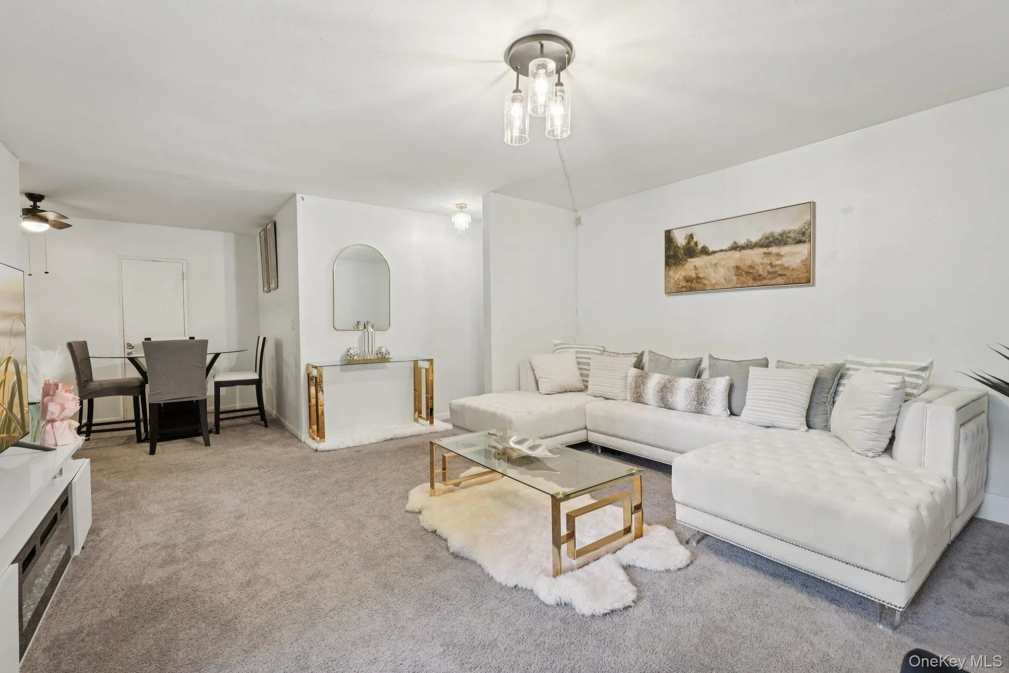 Carpeted living room with baseboards Carpeted living room with baseboards