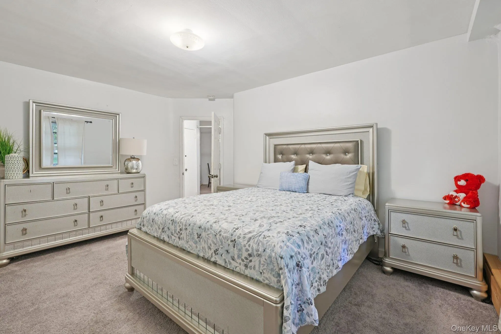 Bedroom with carpet flooring Bedroom with carpet flooring