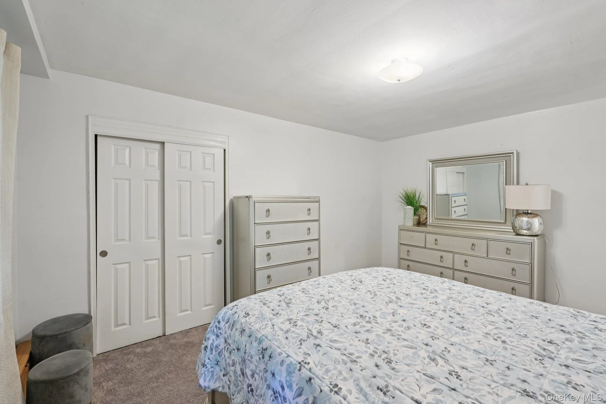 Bedroom with carpet flooring and a closet Bedroom with carpet flooring and a closet
