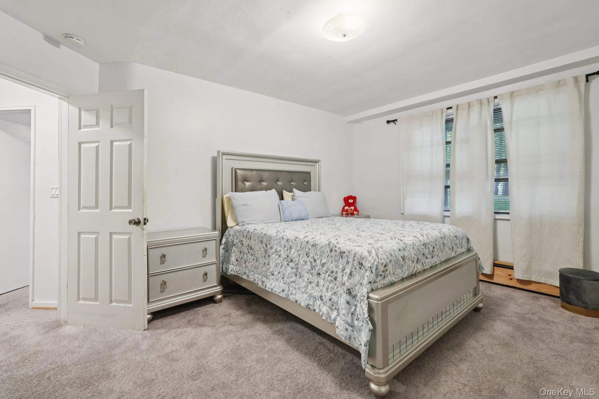 Bedroom featuring carpet flooring Bedroom featuring carpet flooring