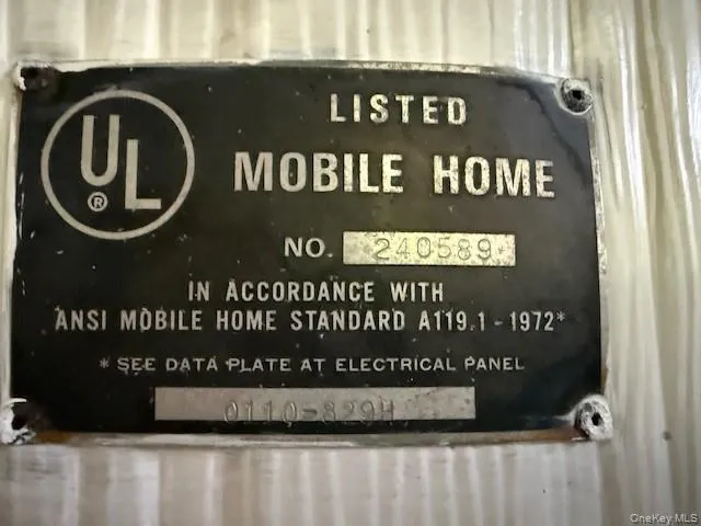 Detailed view of Vintage Mobile Home HUD Plate Detailed view of Vintage Mobile Home HUD Plate