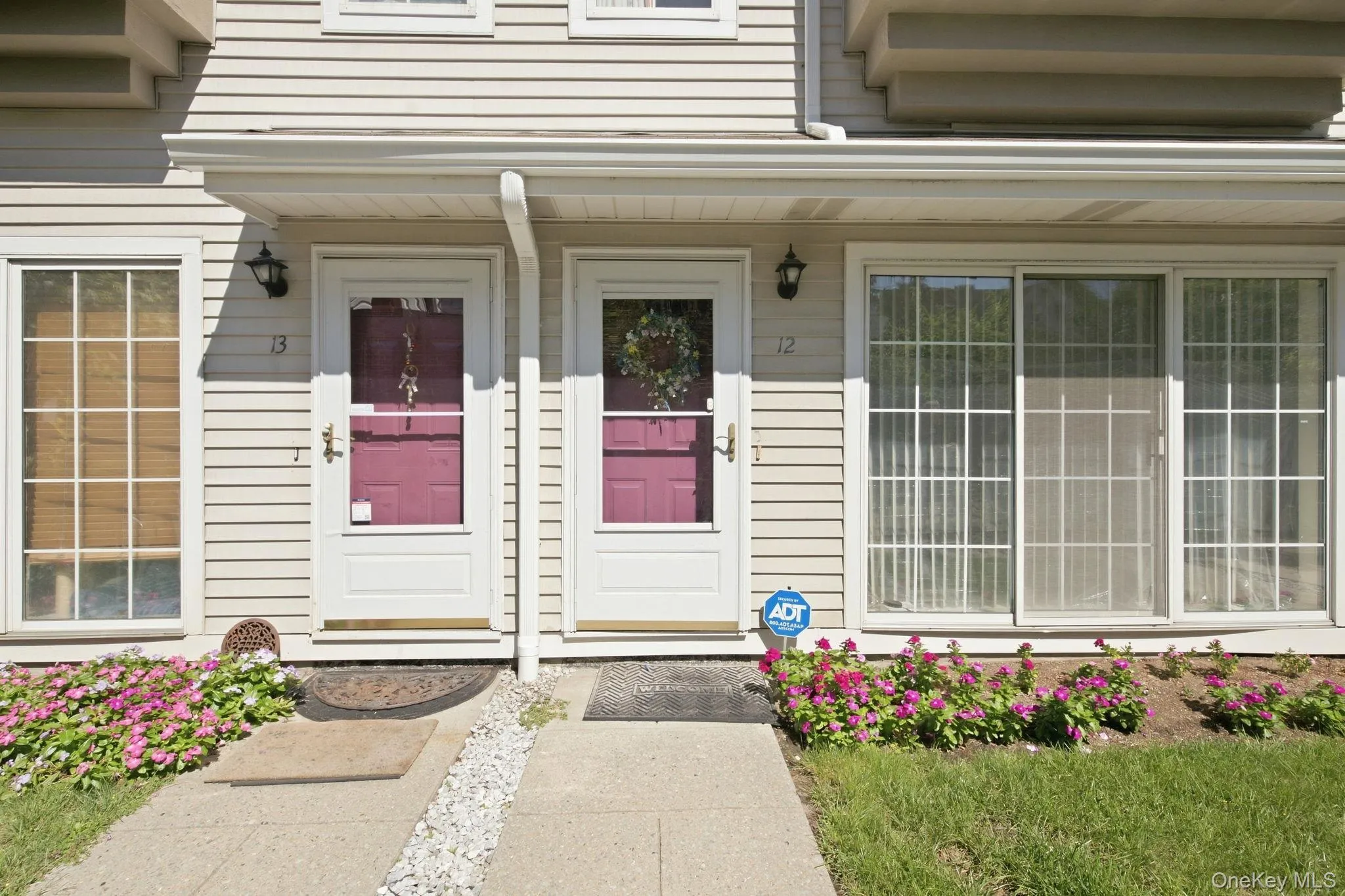 Your own front door at Village Commons, with a covered entry and flowering beds on either side. Your own front door at Village Commons, with a covered entry and flowering beds on either side.