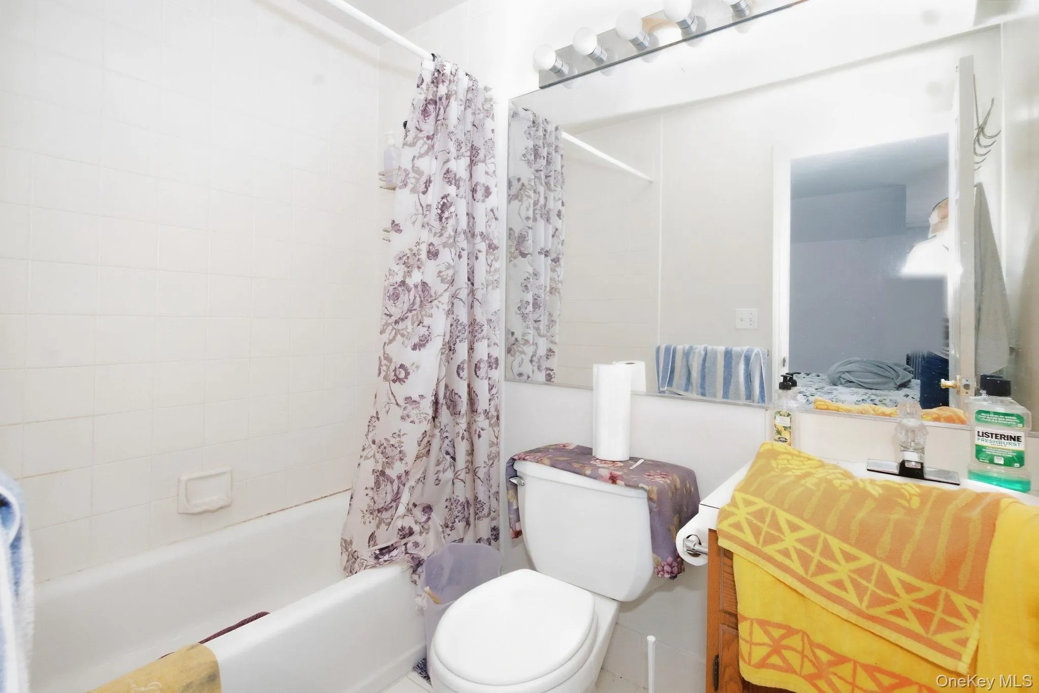 Crisp white tile and a generous mirror give this full bath a clean, simple base. Crisp white tile and a generous mirror give this full bath a clean, simple base.