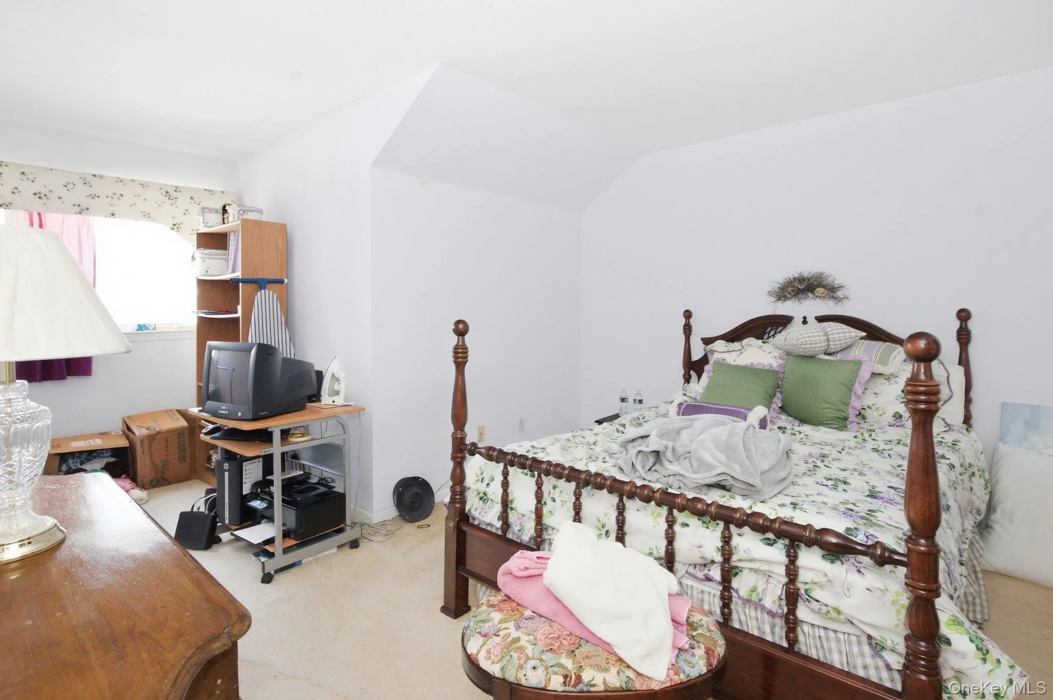 The second bedroom offers angled ceiling lines, natural light and its own en suite full bath. The second bedroom offers angled ceiling lines, natural light and its own en suite full bath.