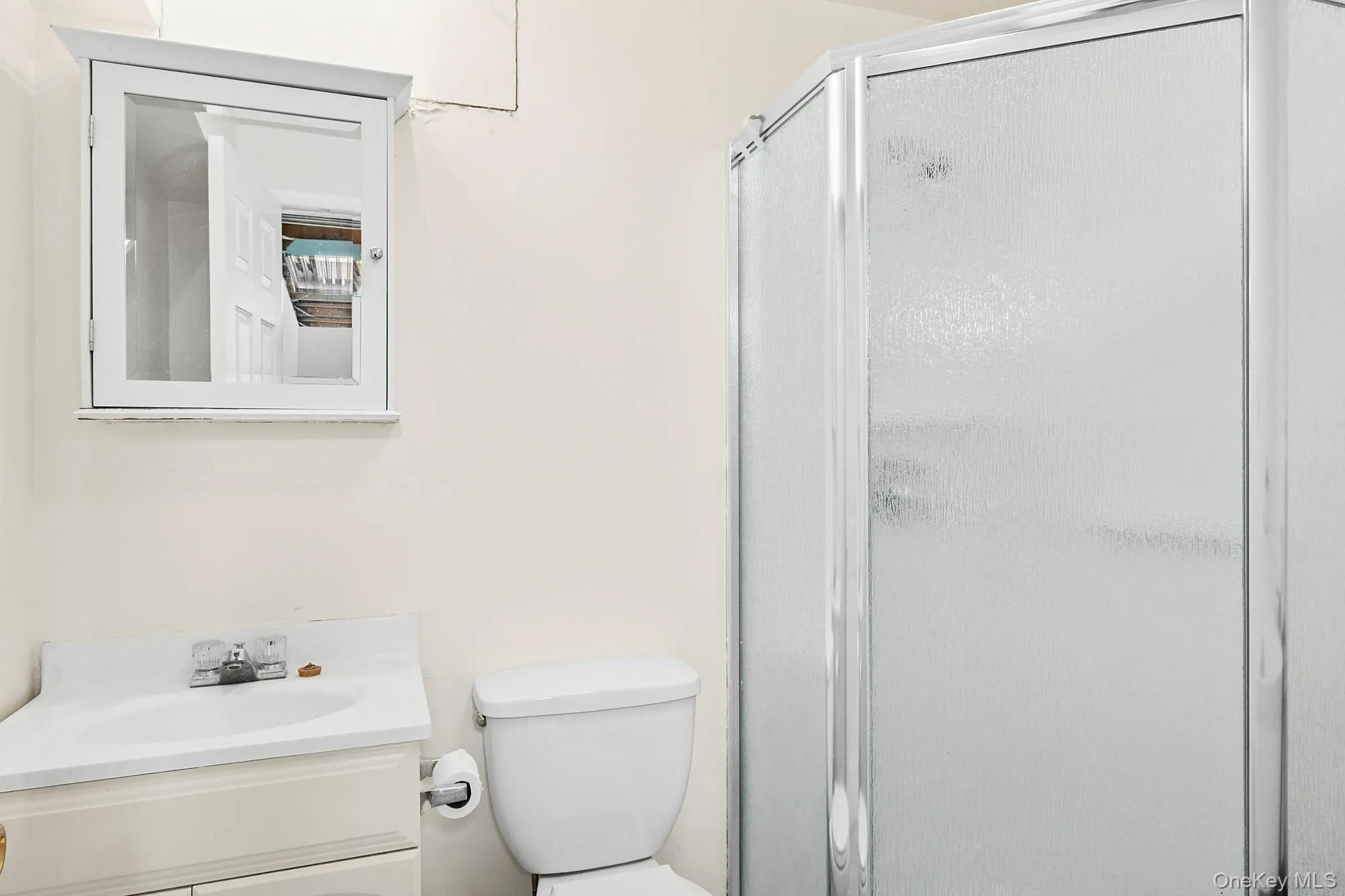 Full bathroom with a shower stall and vanity Full bathroom with a shower stall and vanity