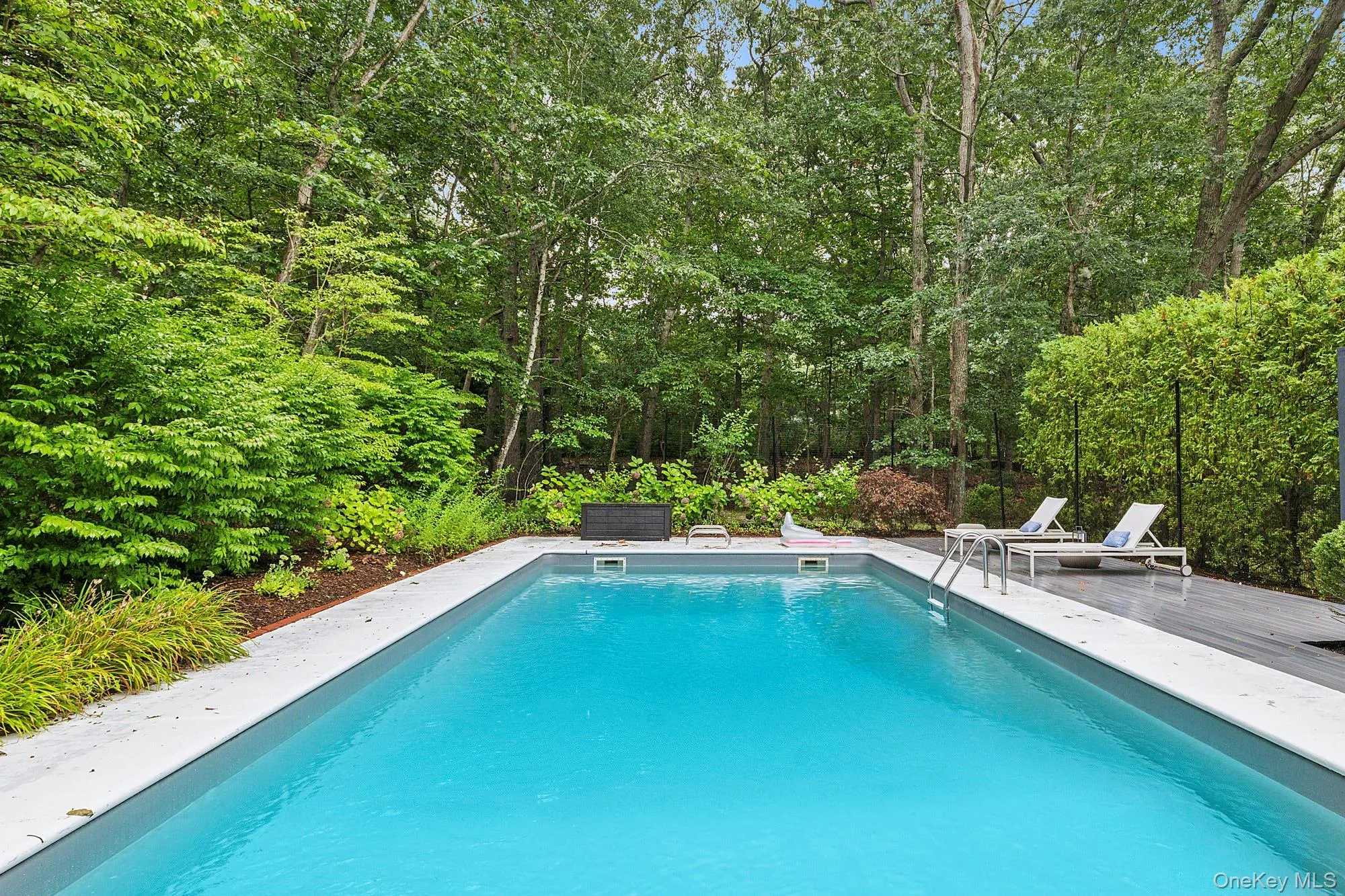 Swimming pool featuring a patio Swimming pool featuring a patio