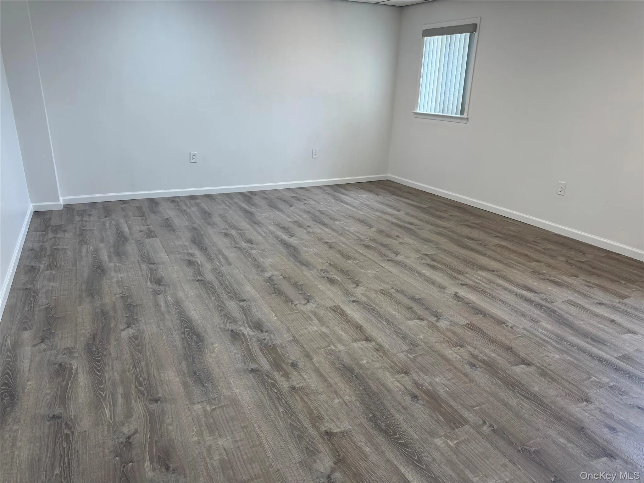 Empty room featuring wood finished floors Empty room featuring wood finished floors