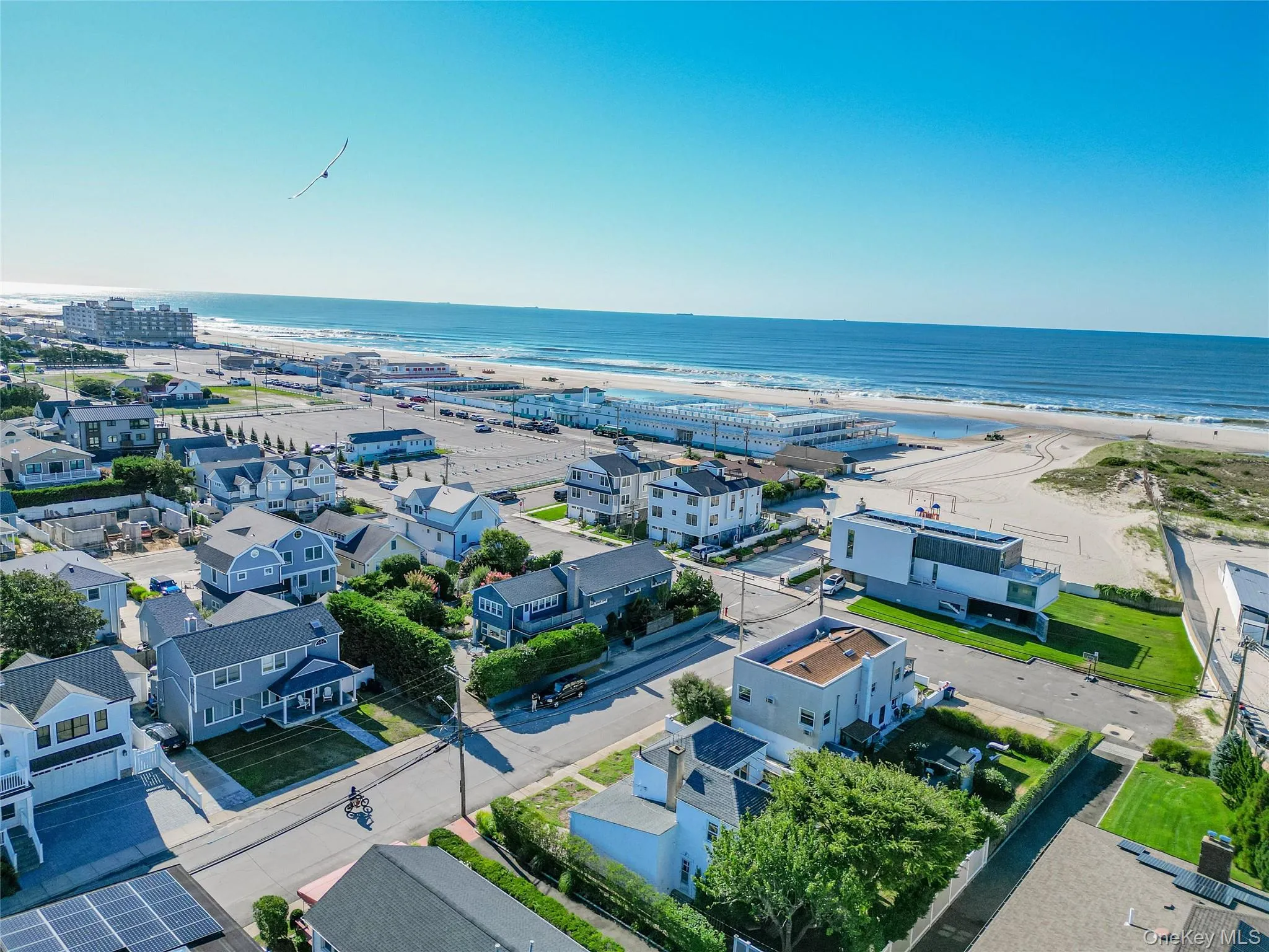 Aerial view of residential area featuring unending shoreline Aerial view of residential area featuring unending shoreline
